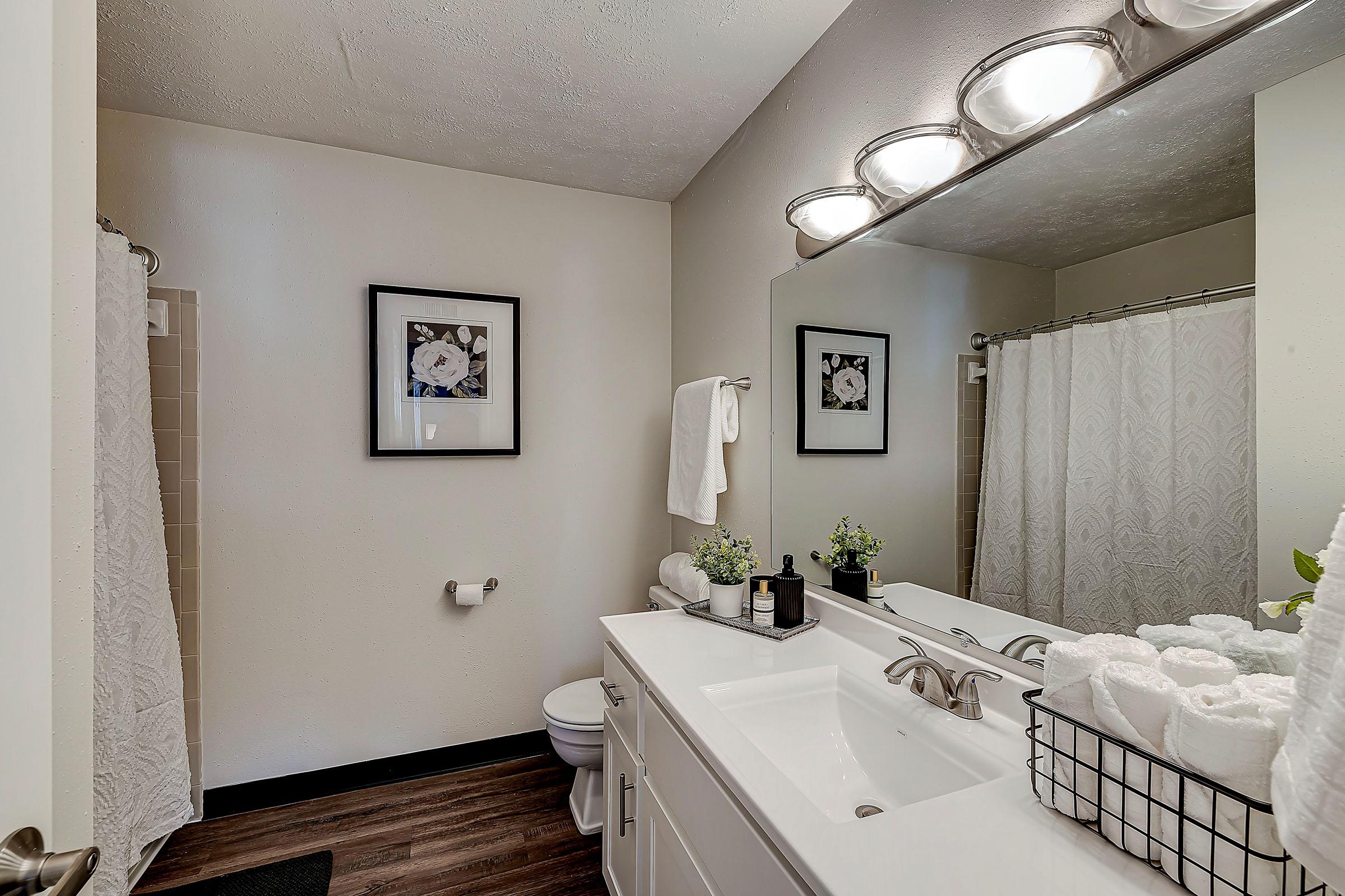 a bedroom with a large mirror