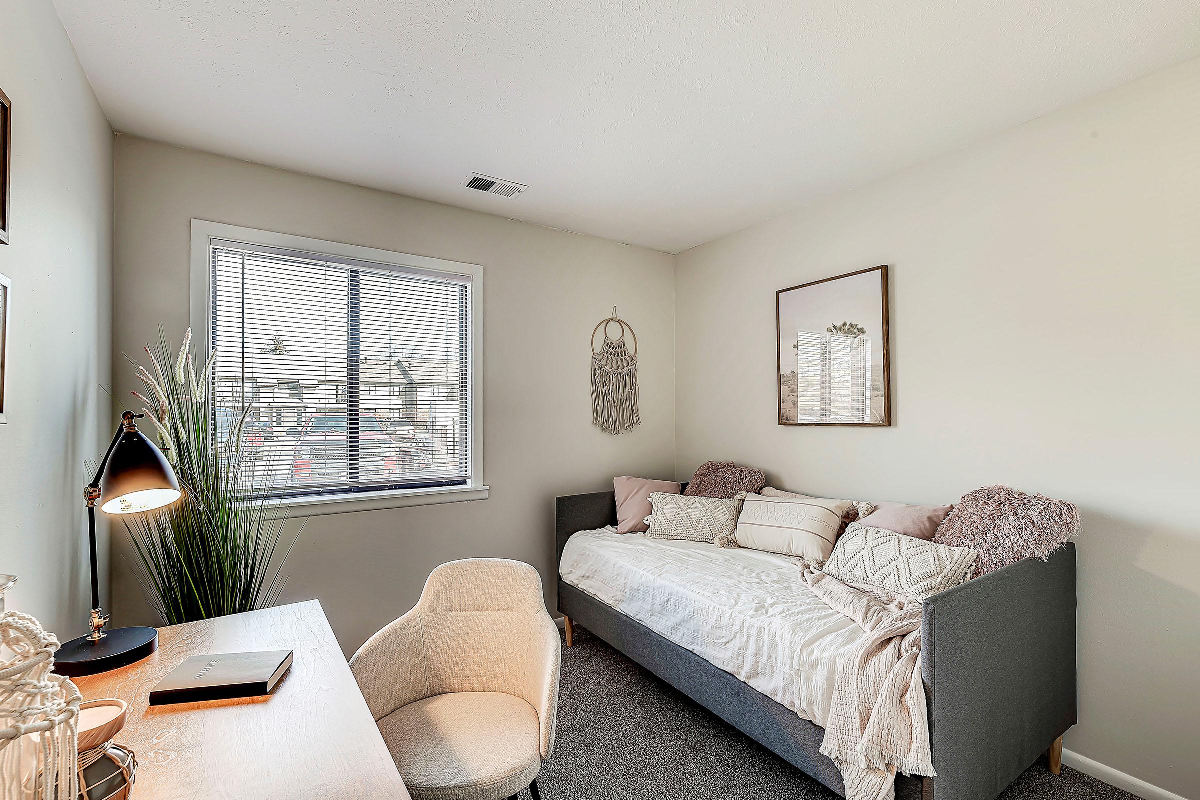 a living room filled with furniture and a rug