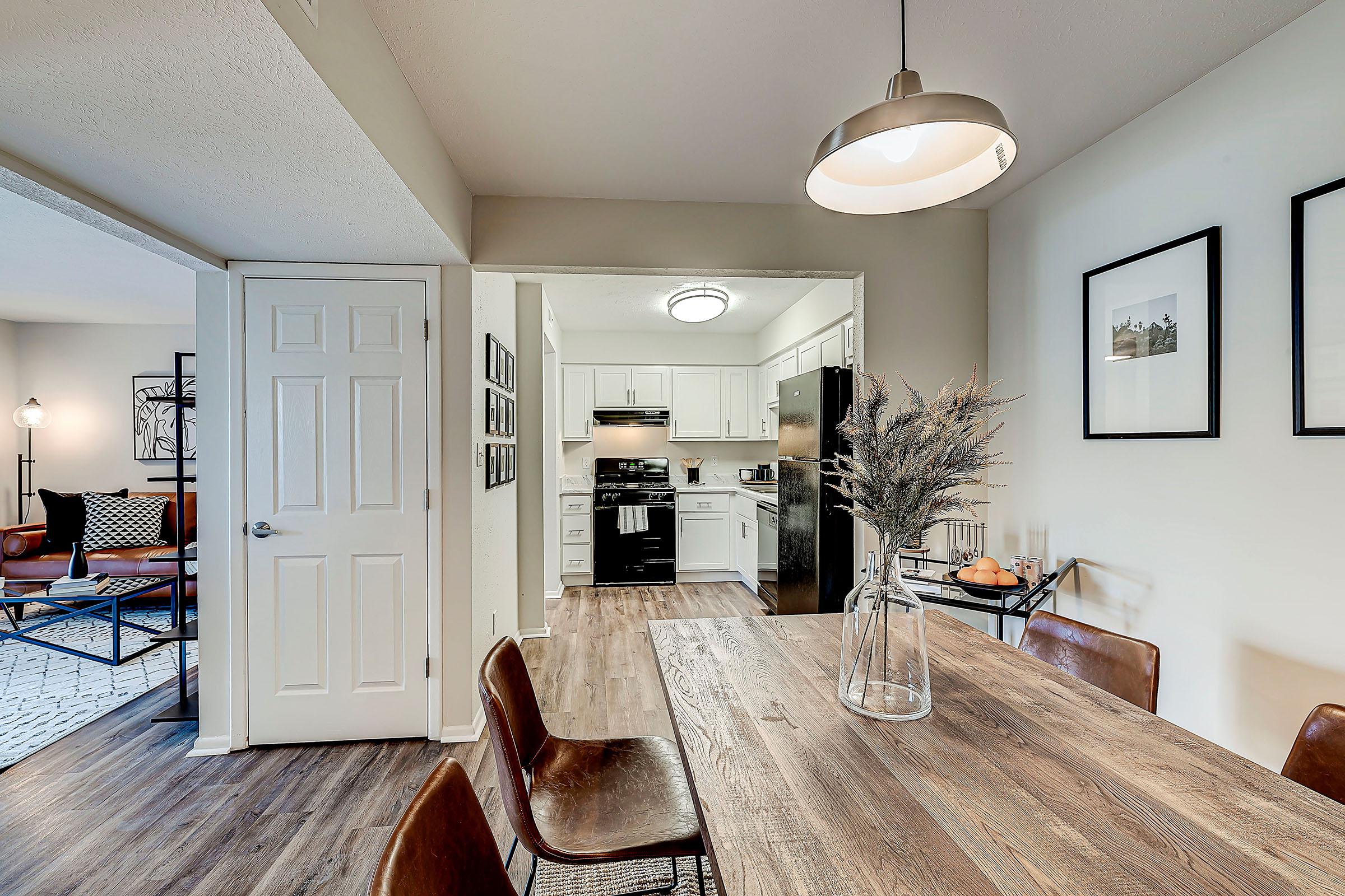 a living room filled with furniture and a flat screen tv