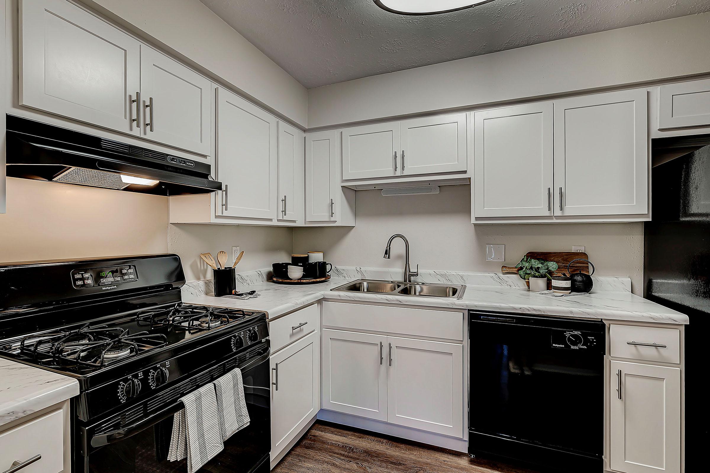 a kitchen with a stove top oven