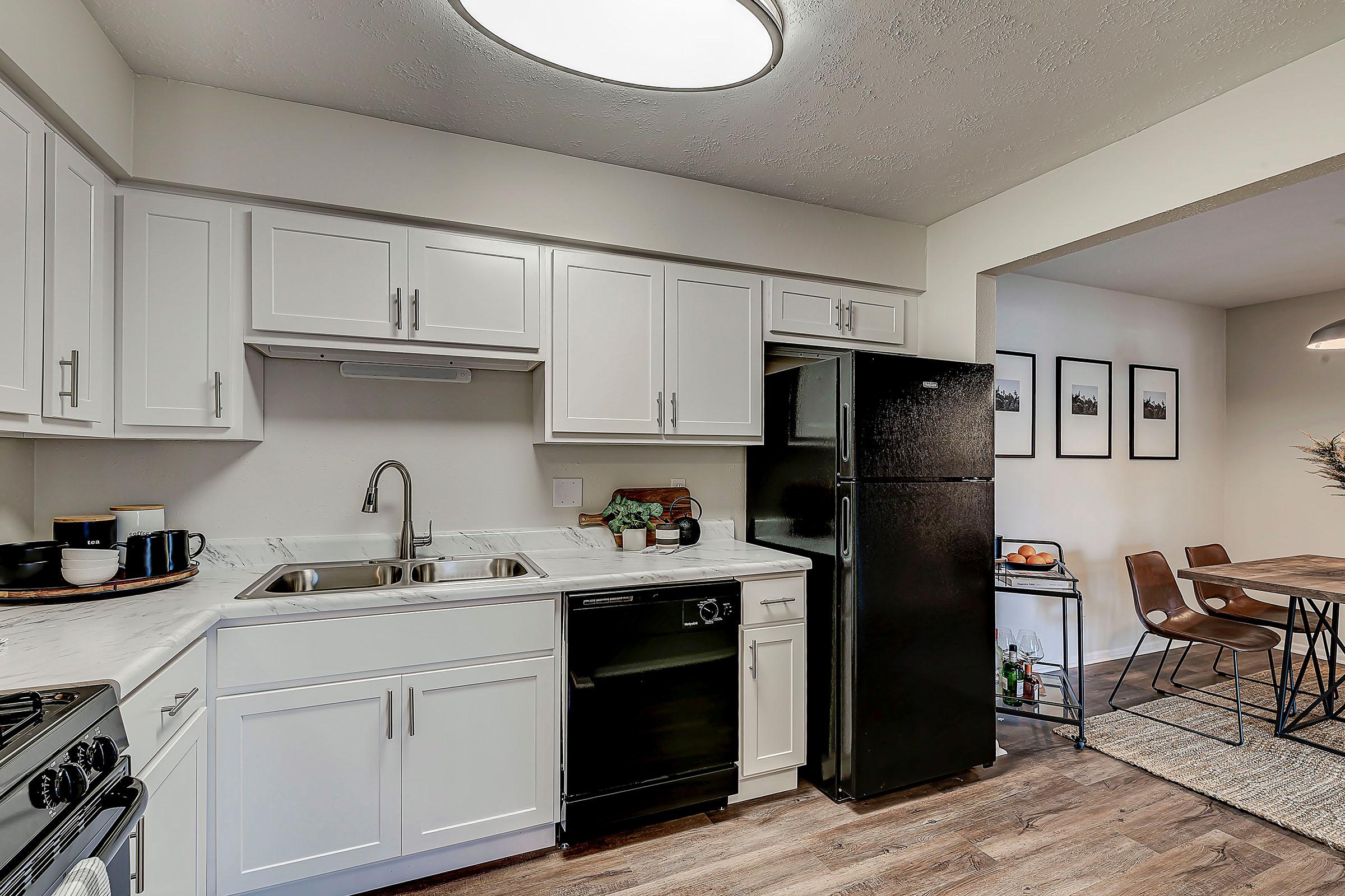 a kitchen filled with lots of furniture