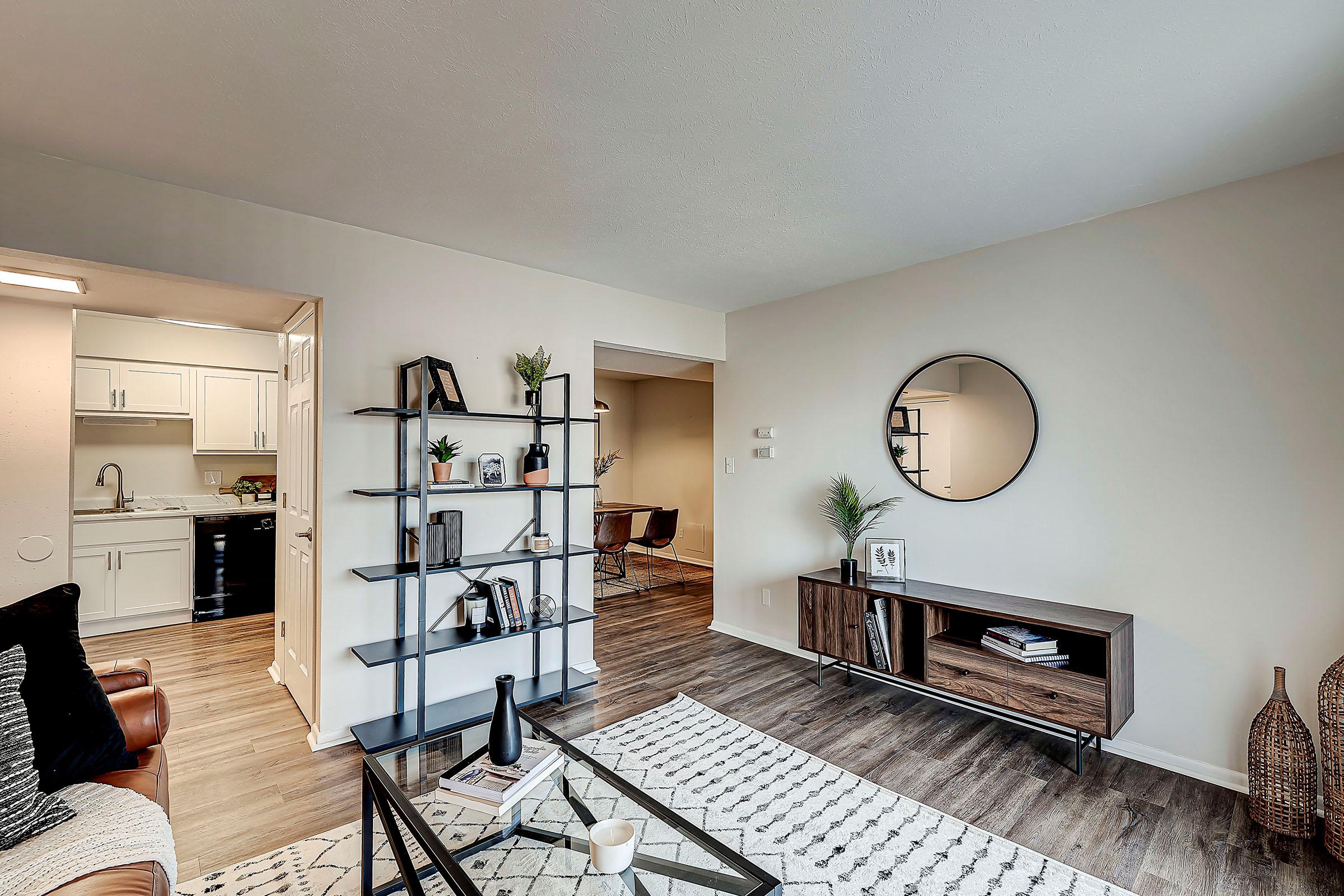 a living room filled with furniture and a fireplace