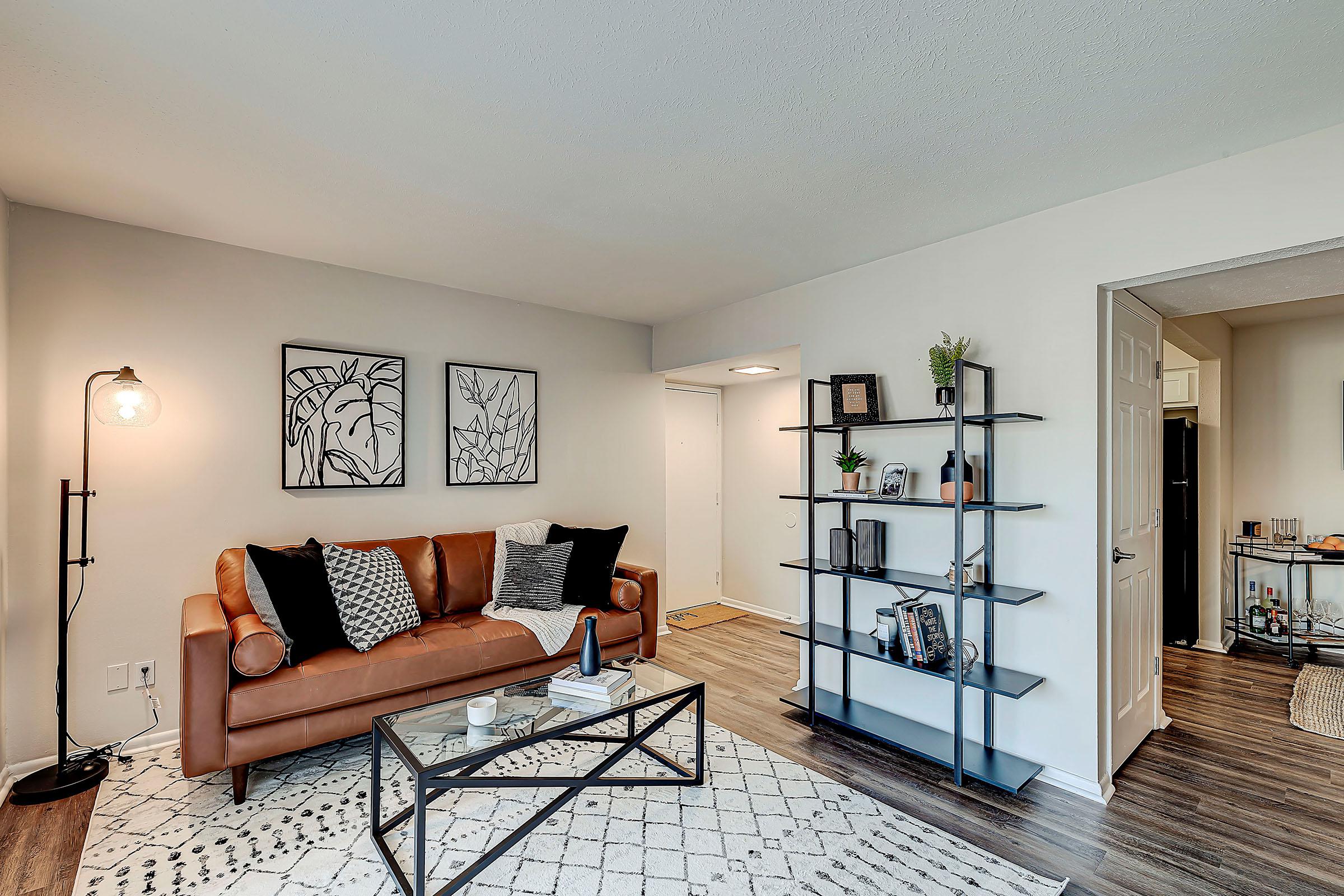 a living room filled with furniture and a fireplace