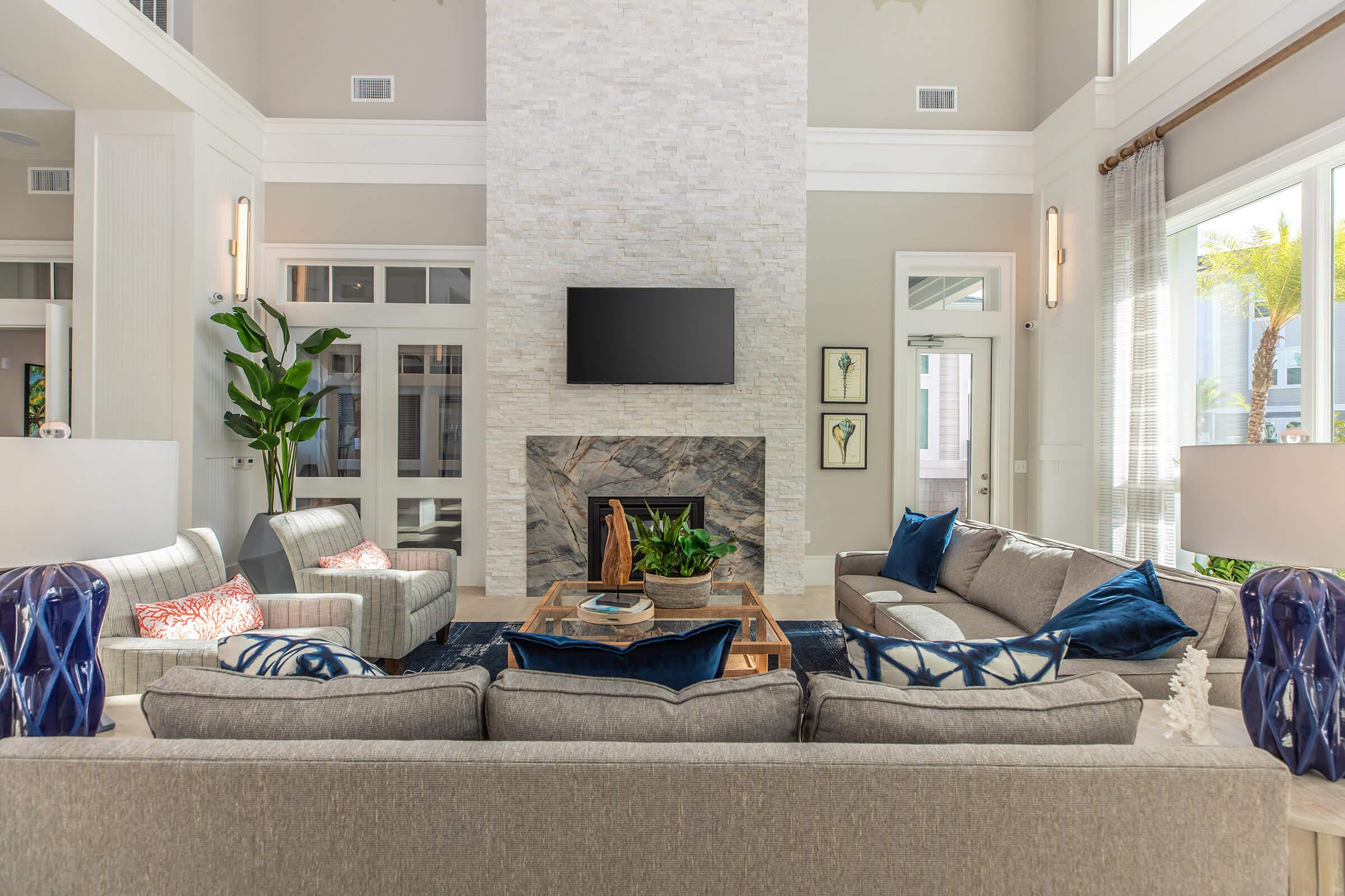 a living room filled with furniture and a fire place