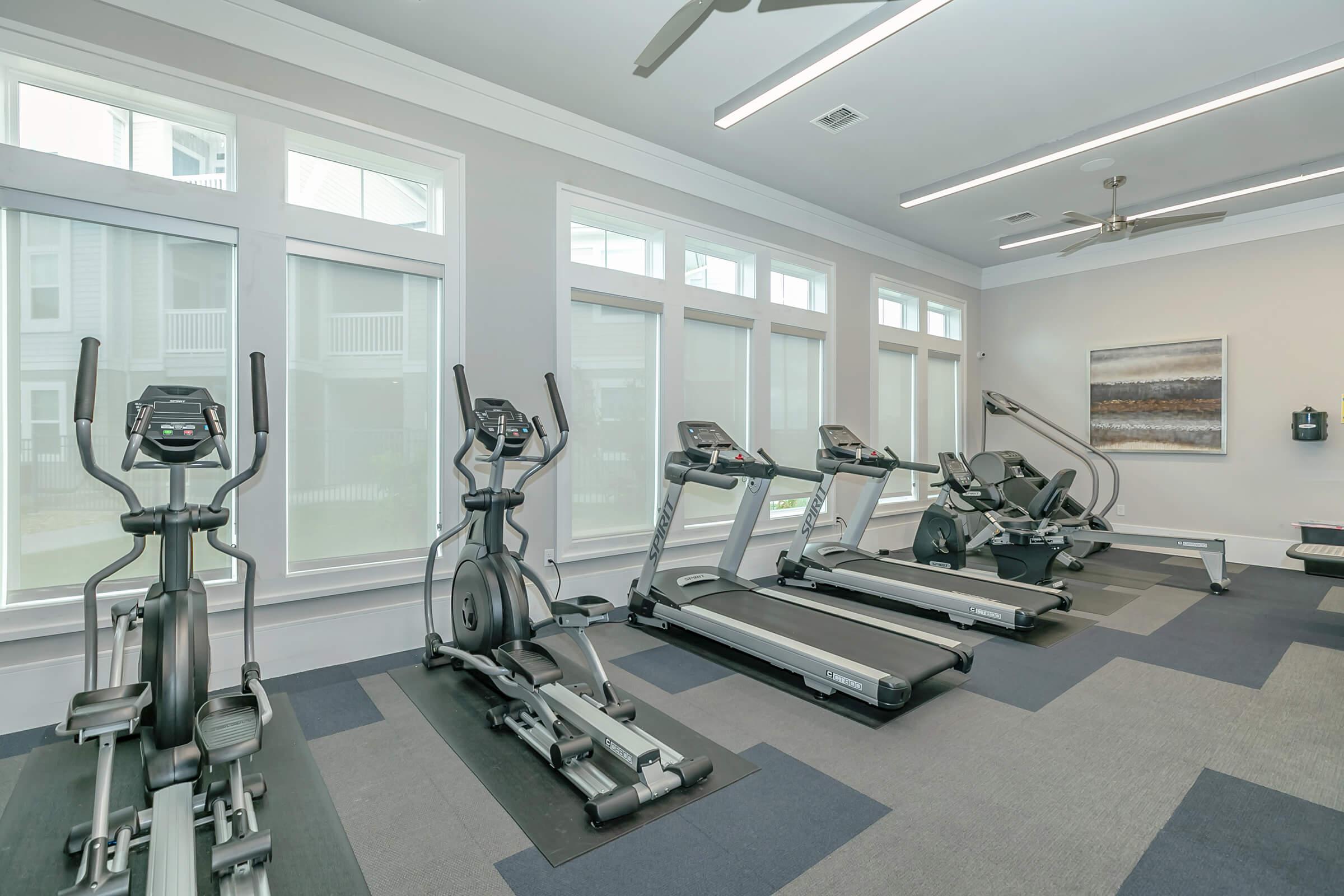 a room filled with furniture and a large window