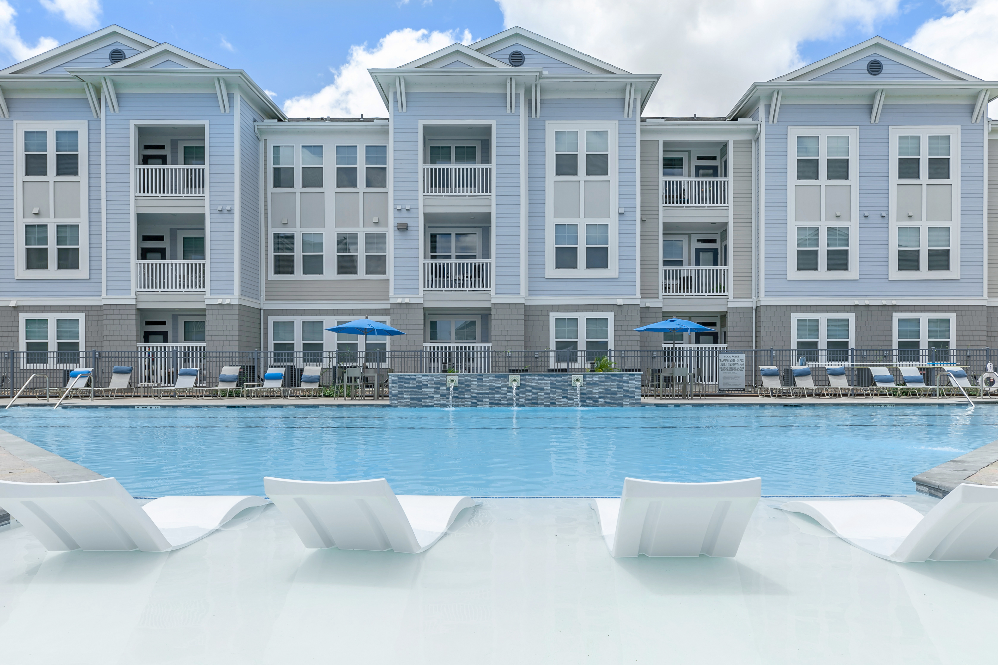 a large pool of water in front of a building