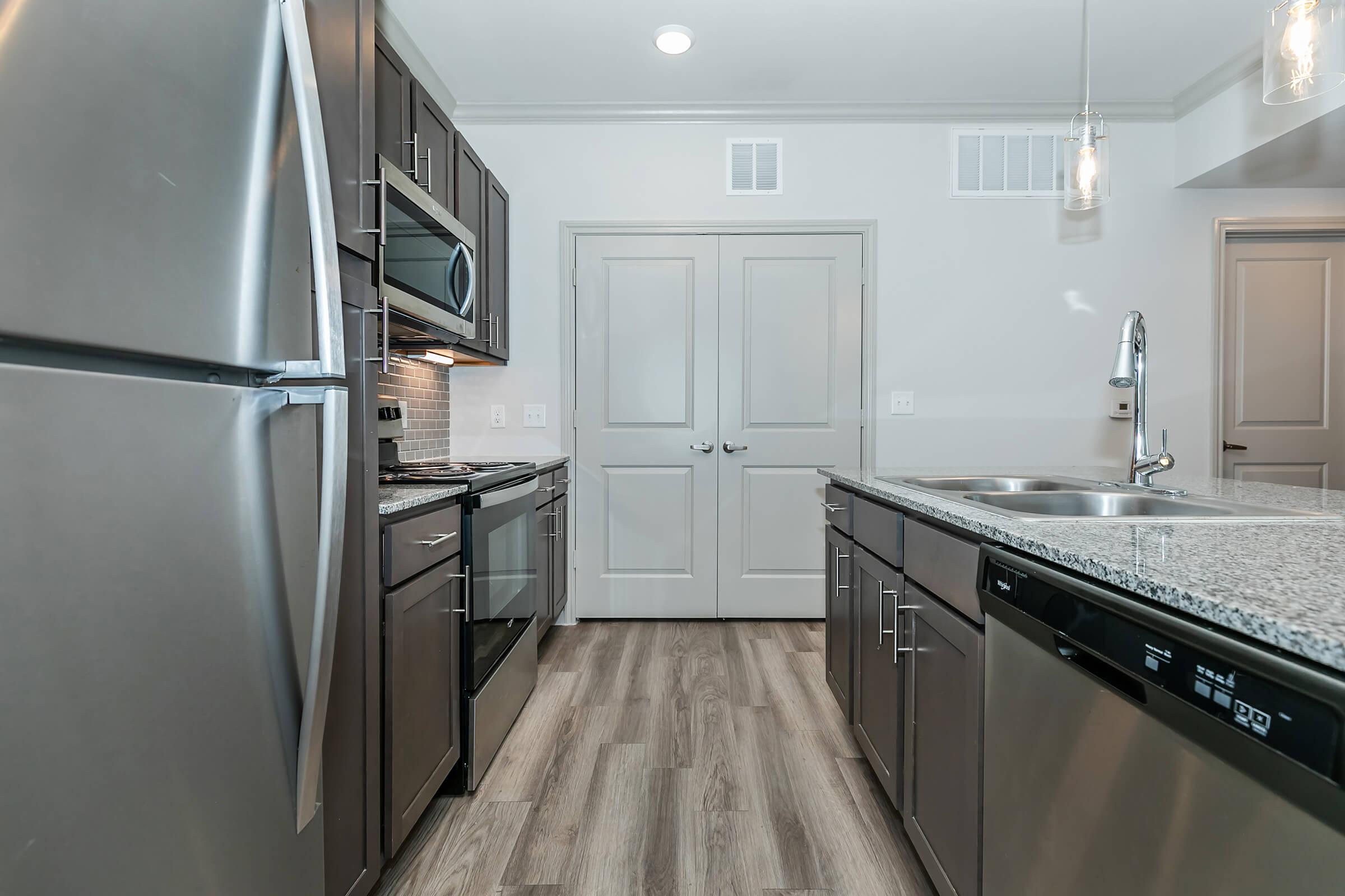 a large kitchen with stainless steel appliances