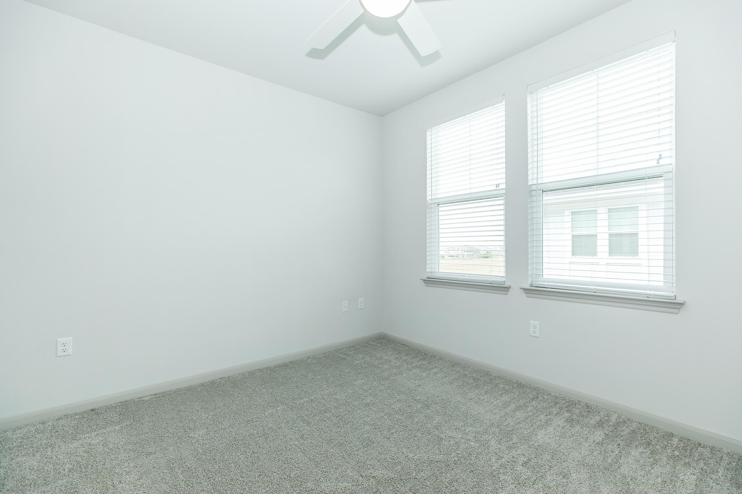 a bedroom with a large window