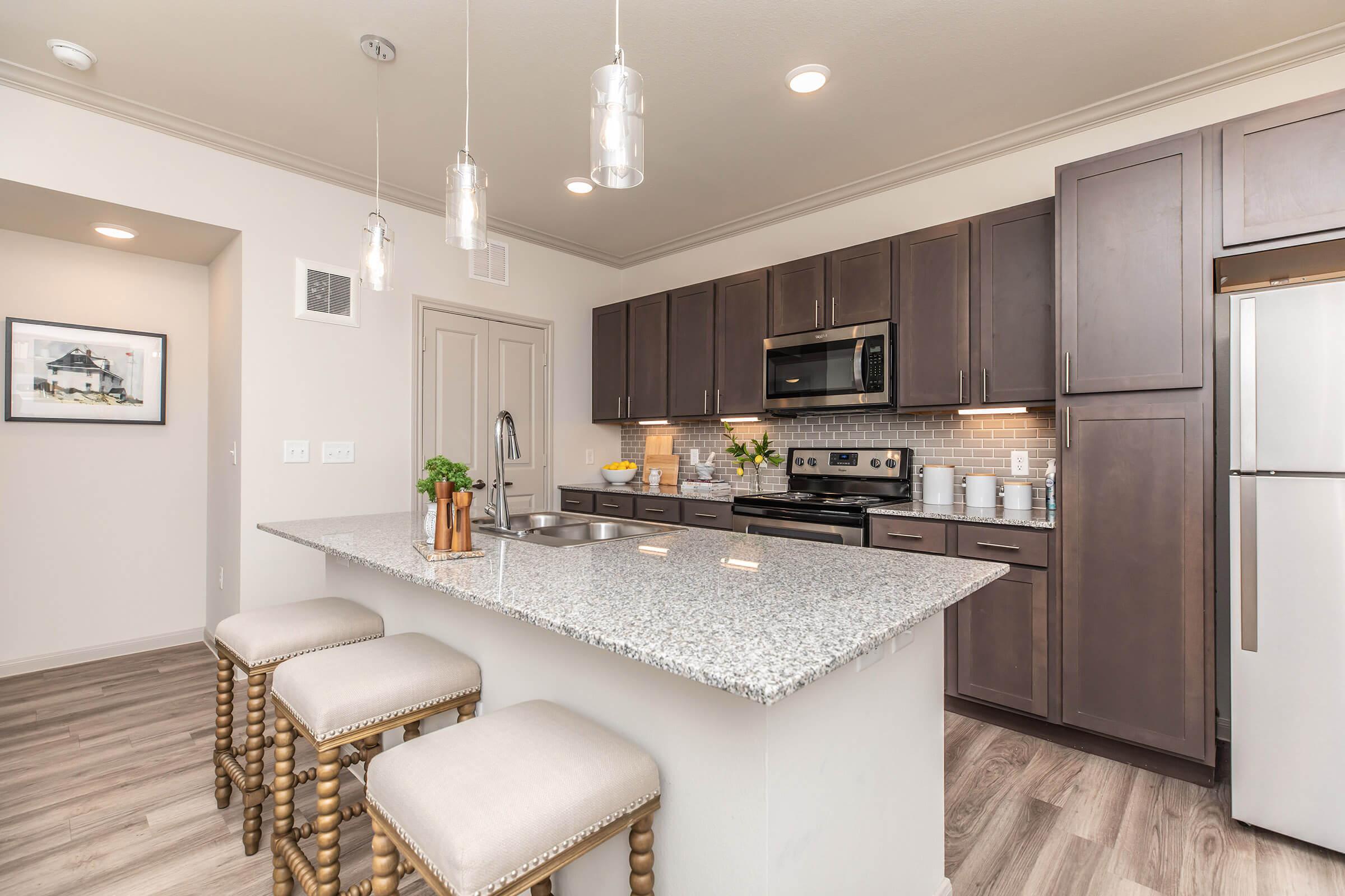 a modern kitchen with stainless steel appliances