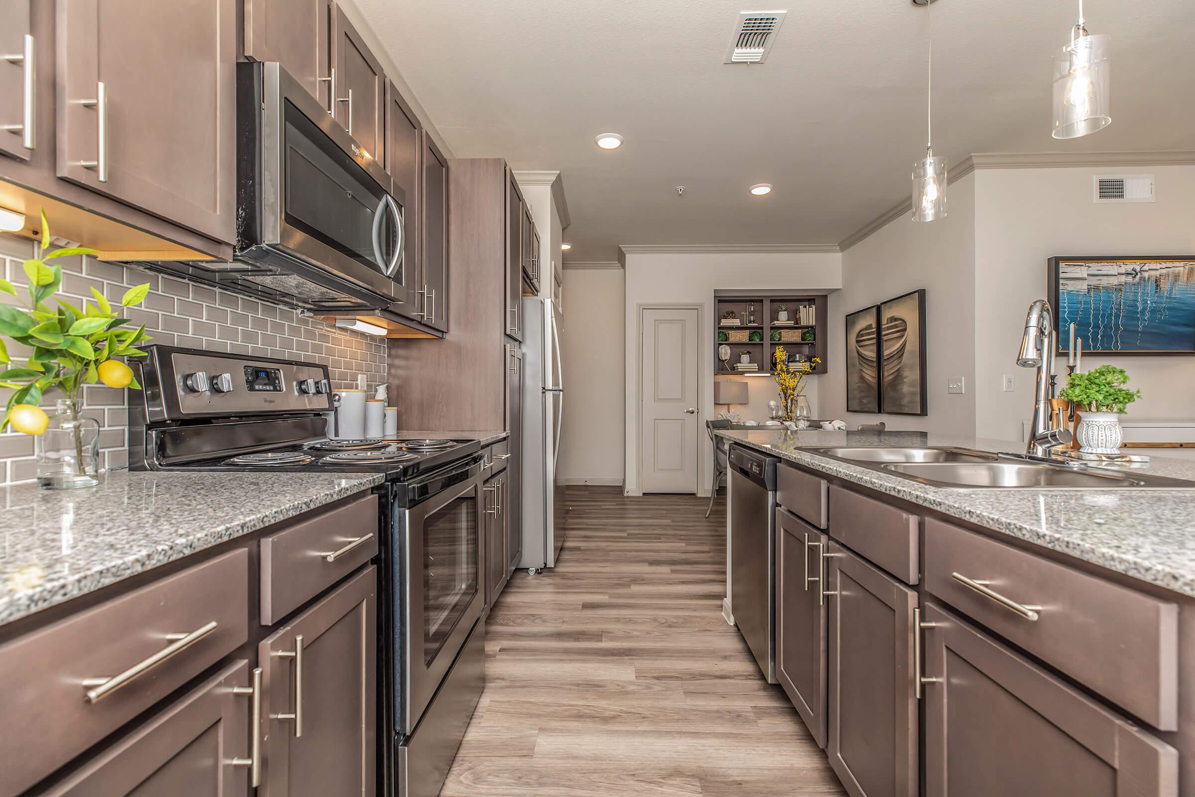 a large kitchen with stainless steel appliances