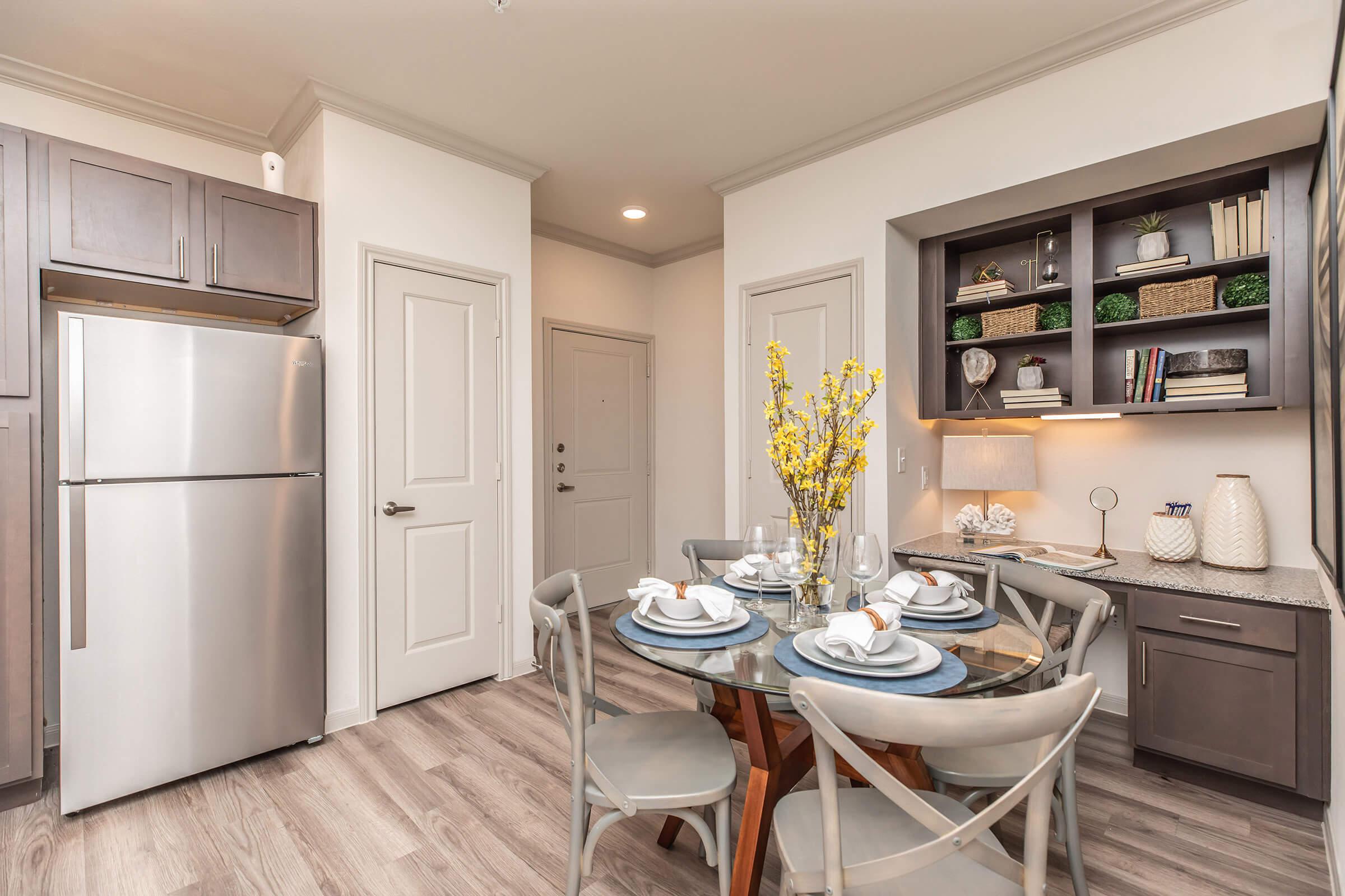 a kitchen area with a building in the background