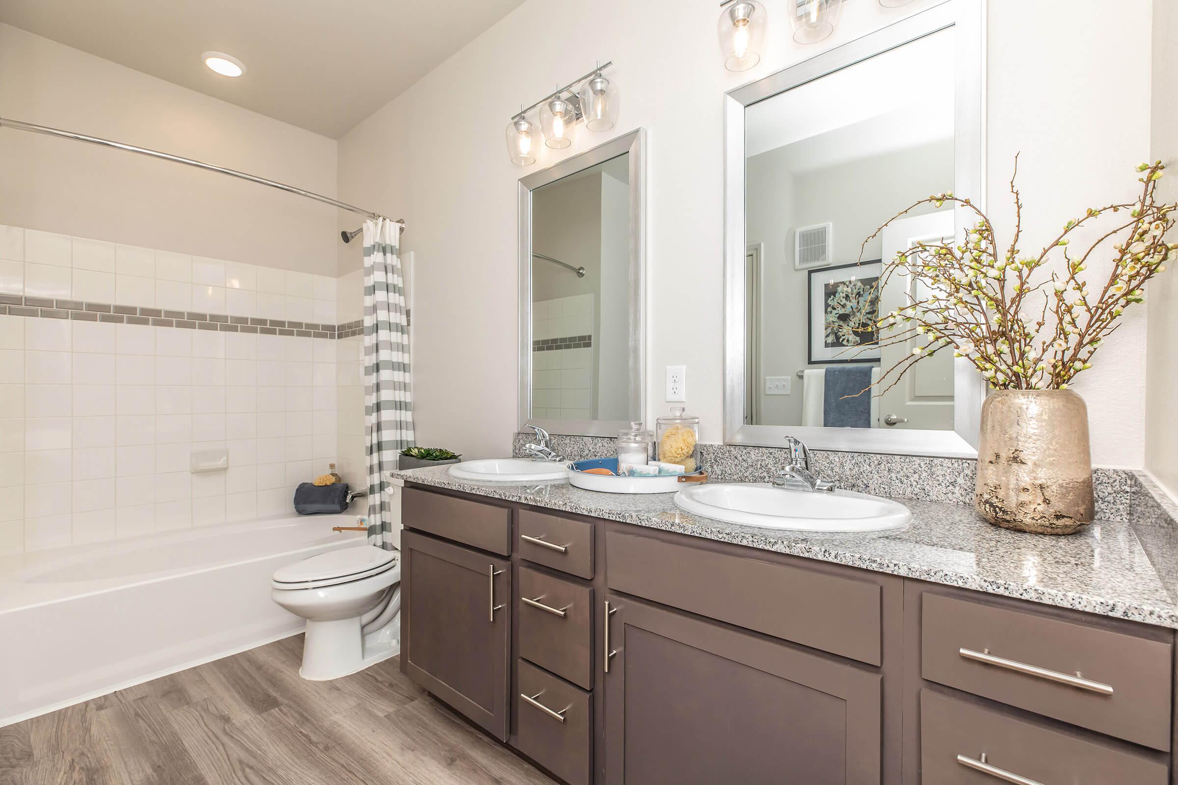 a kitchen with a sink and a mirror