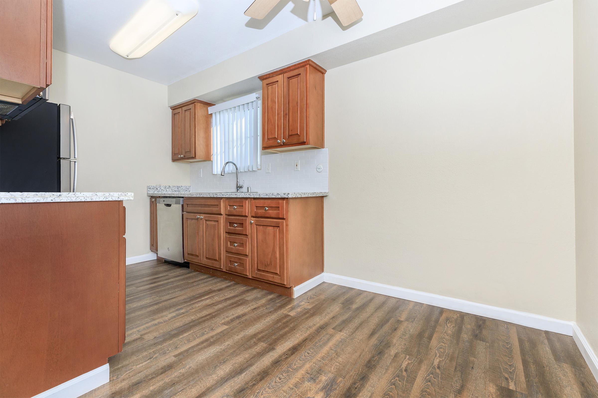 a kitchen with a wooden floor