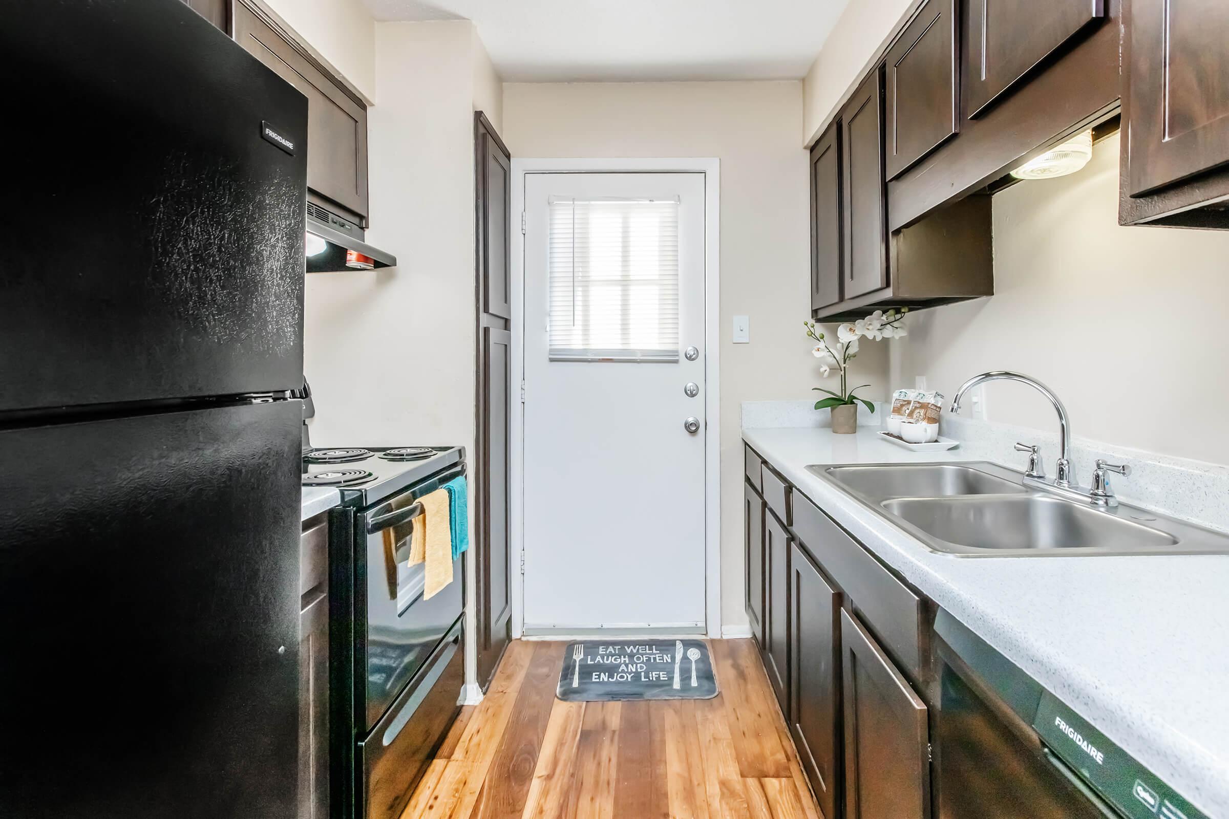 a large kitchen with stainless steel appliances