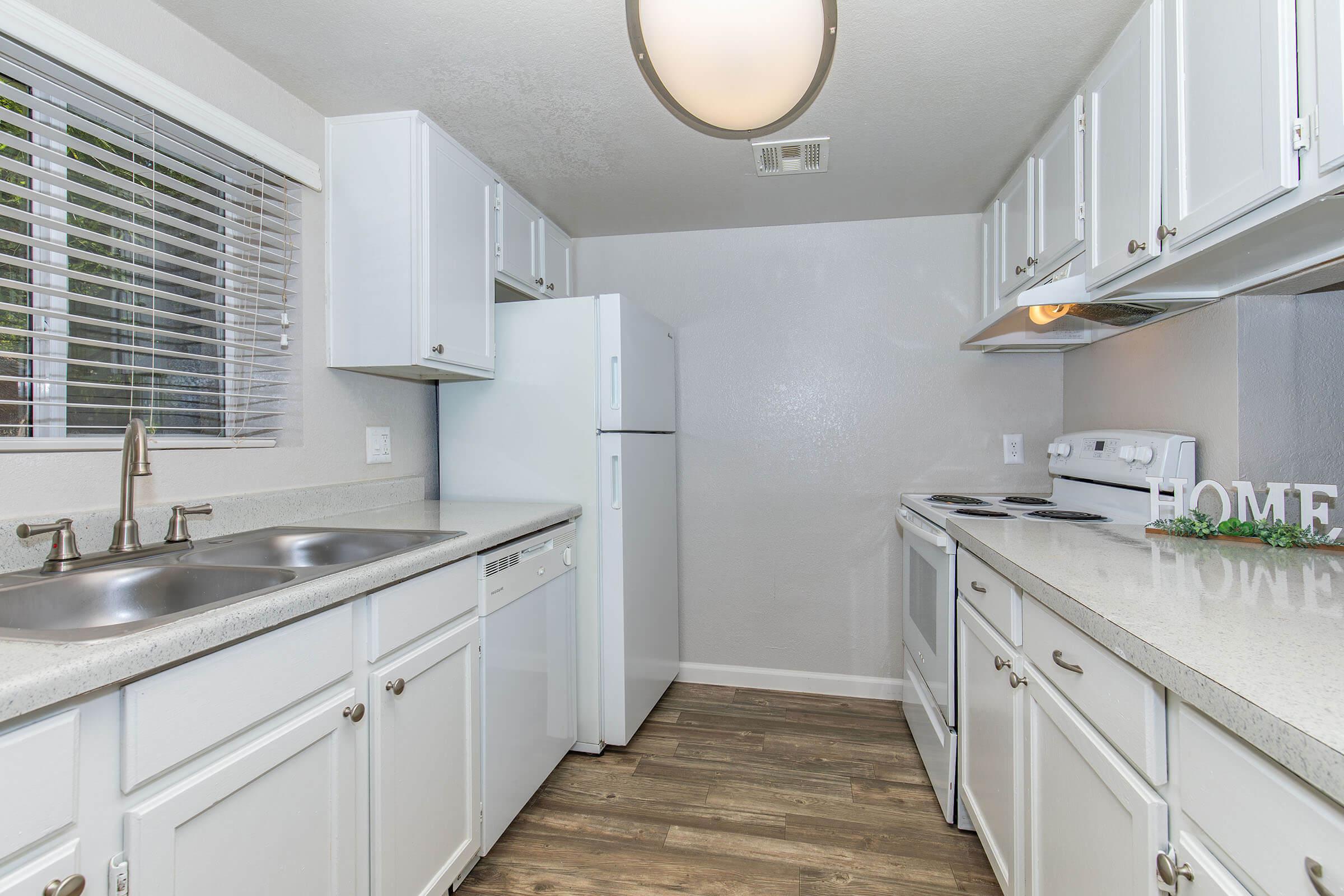 a kitchen with a sink and a window