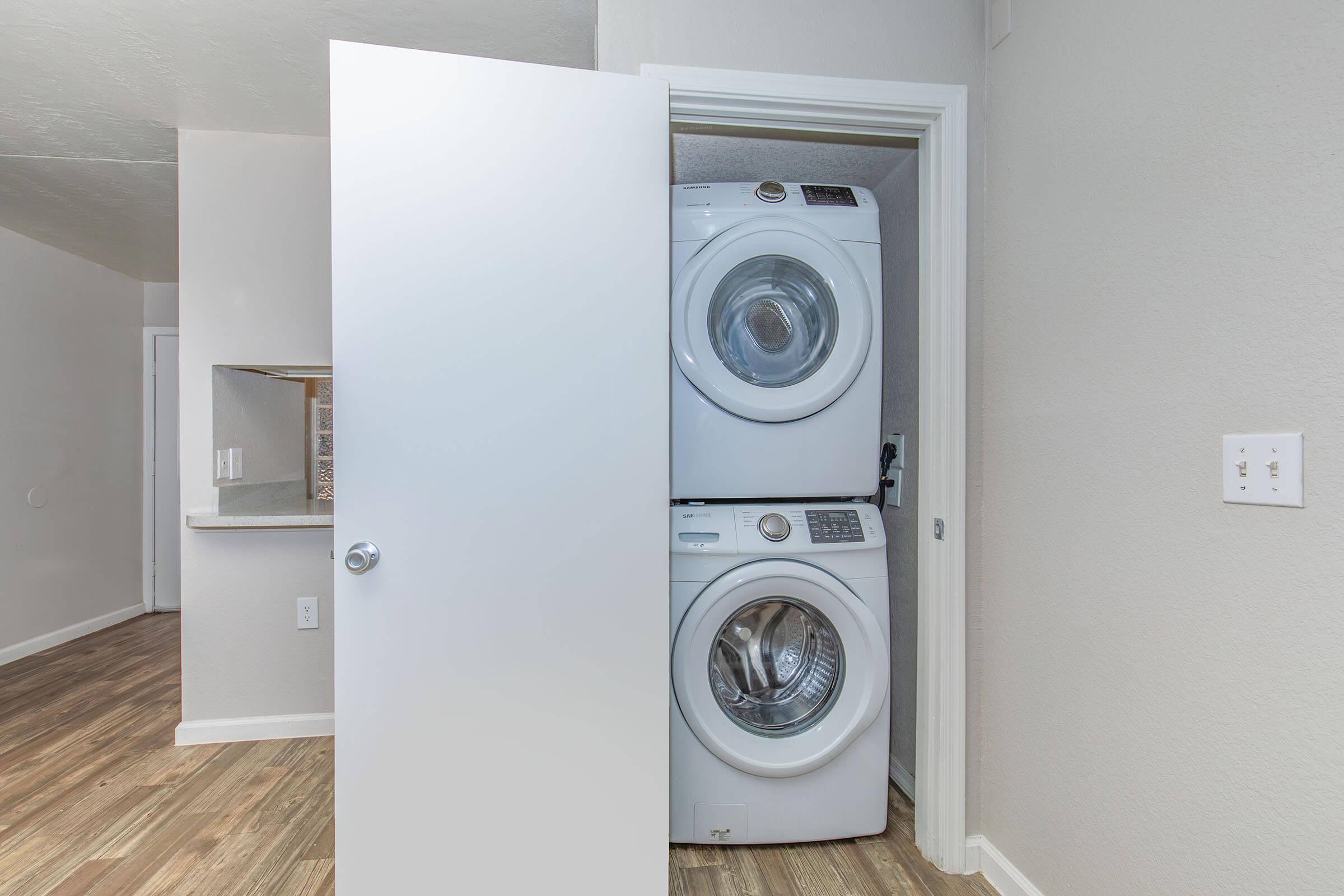 a clock sits at the top of a refrigerator