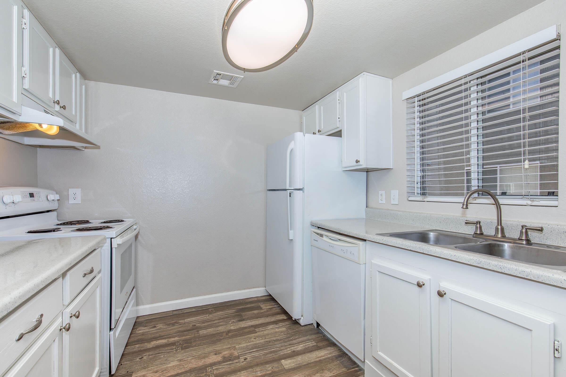 a kitchen with a stove and a sink