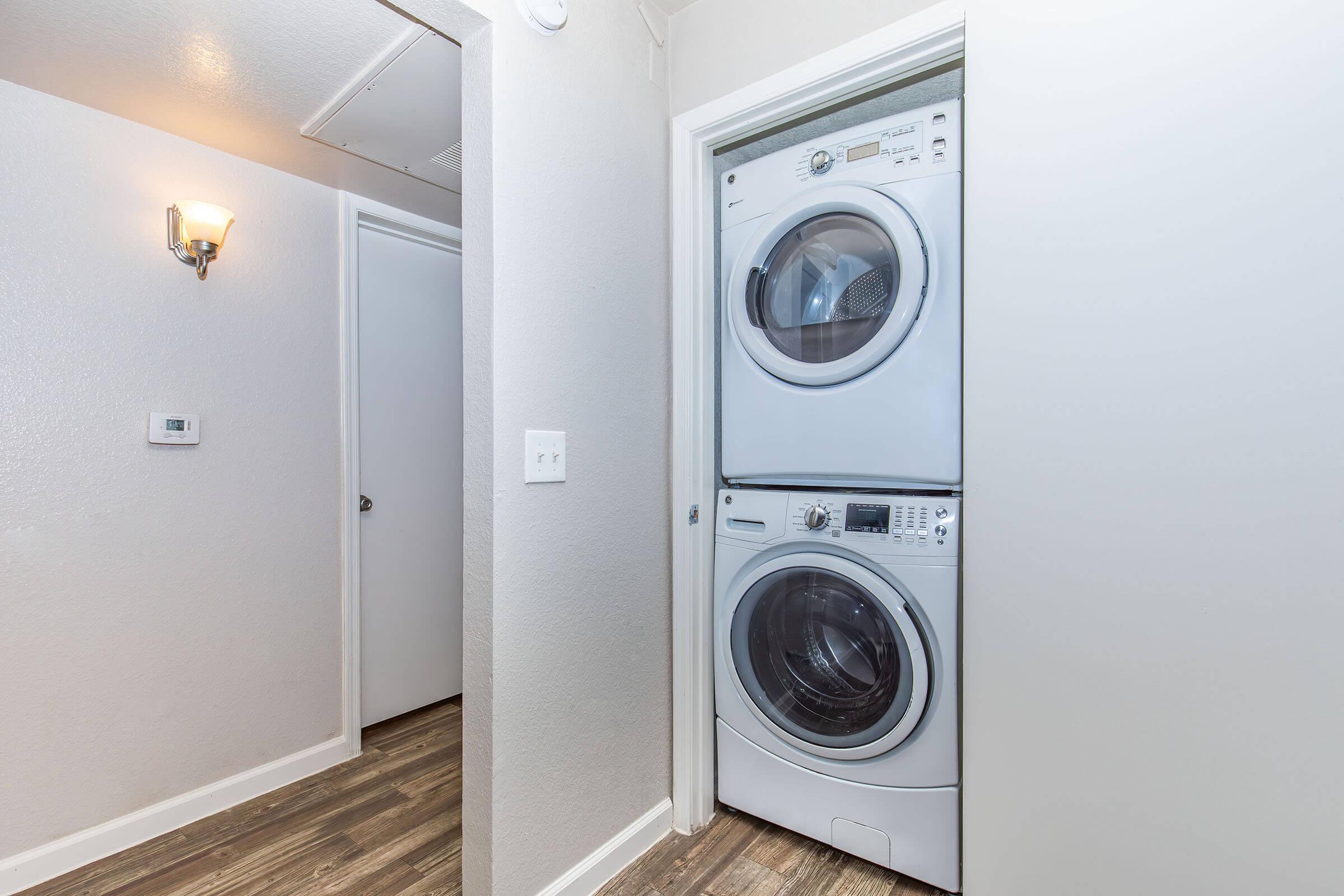 a microwave oven sitting on top of a refrigerator