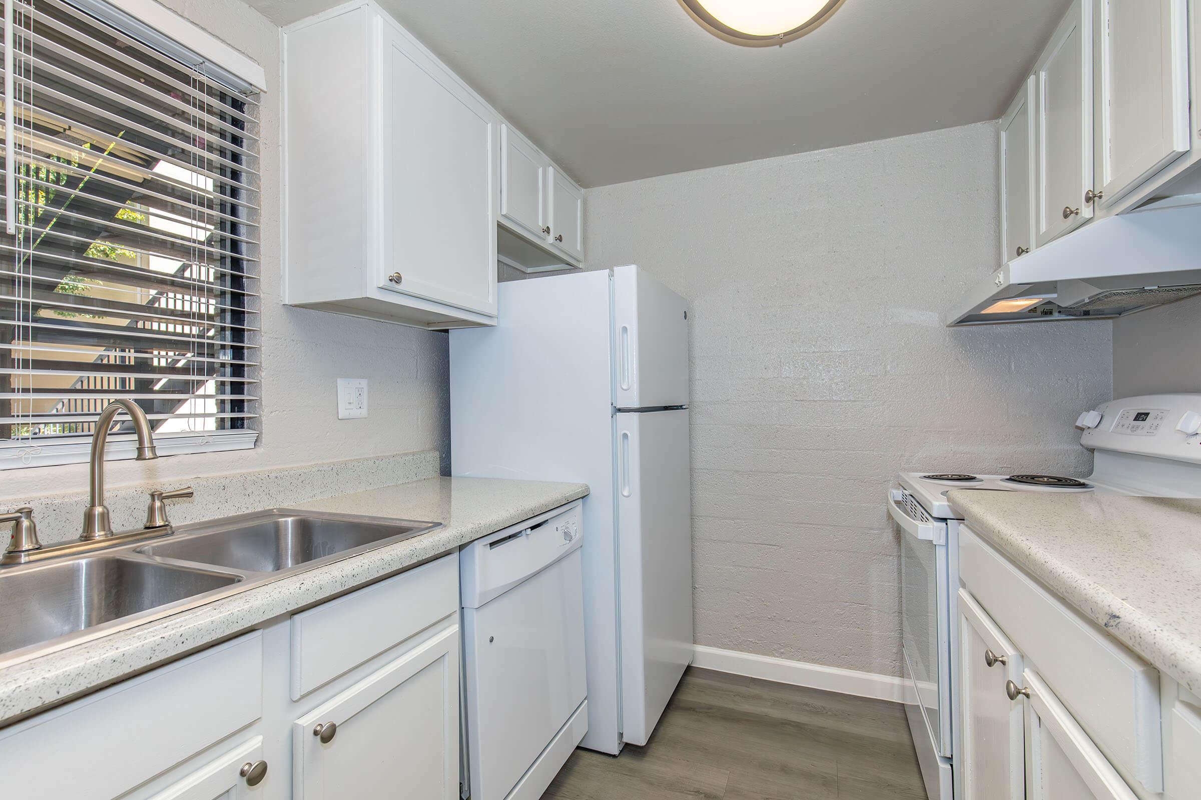 a kitchen with a sink and a window