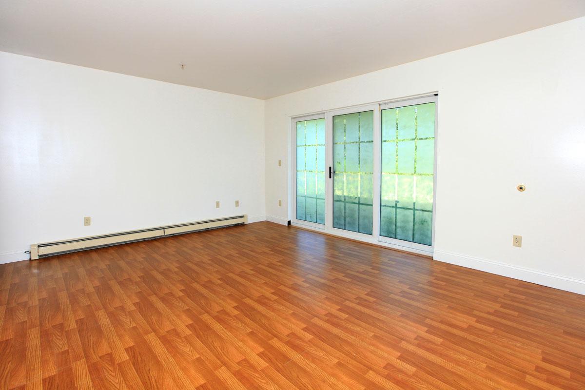 a large empty room with a hard wood floor