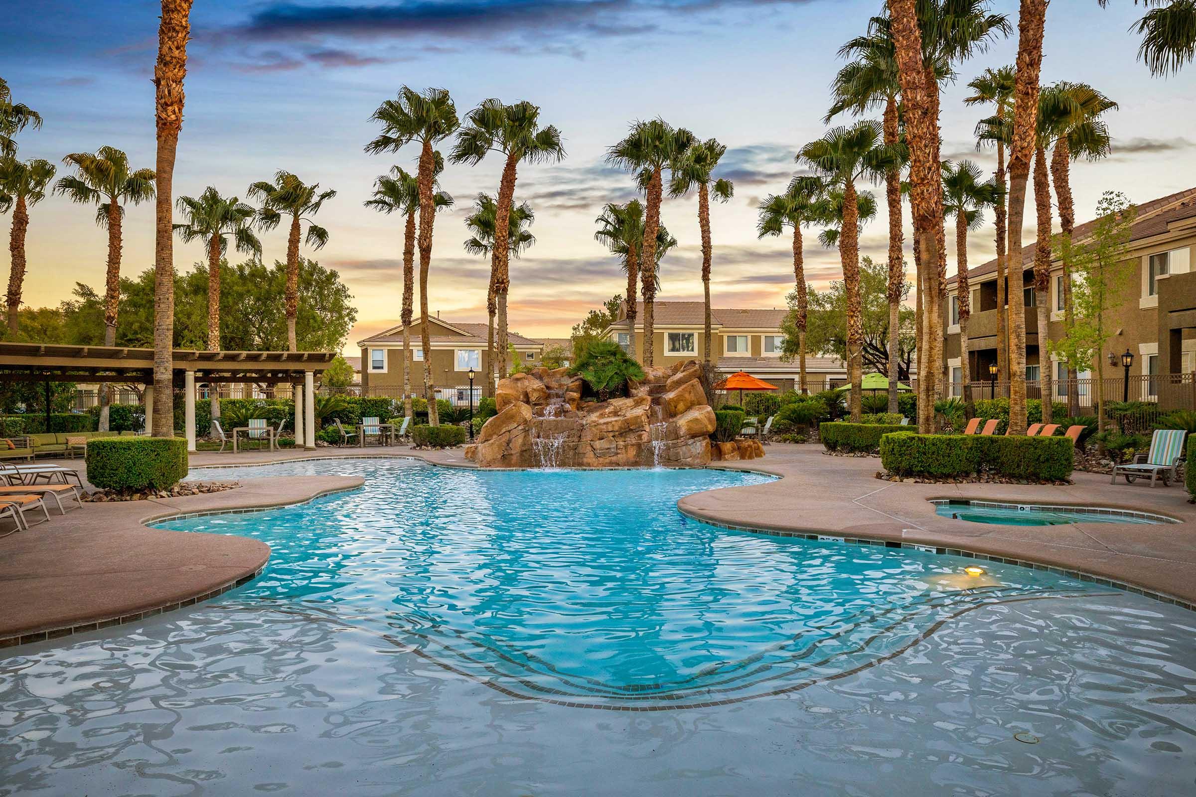 view of pool at dusk