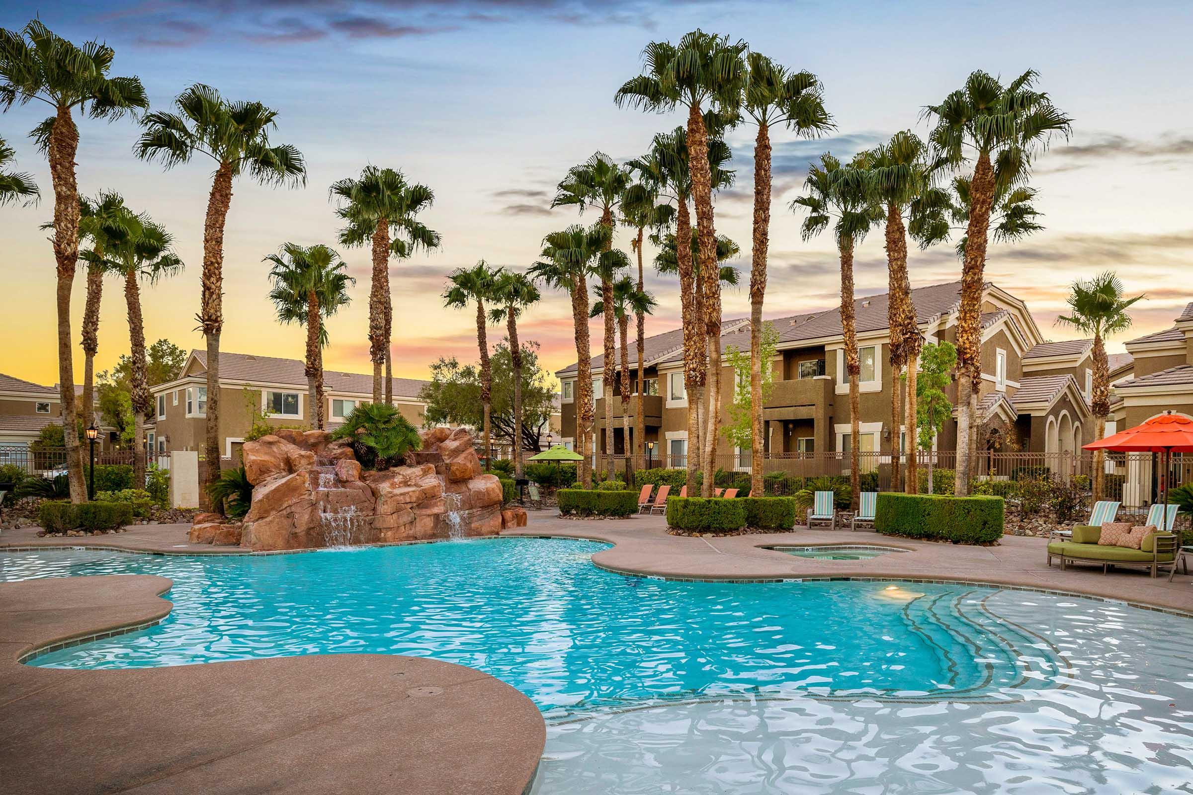 pool and palm trees at dusk