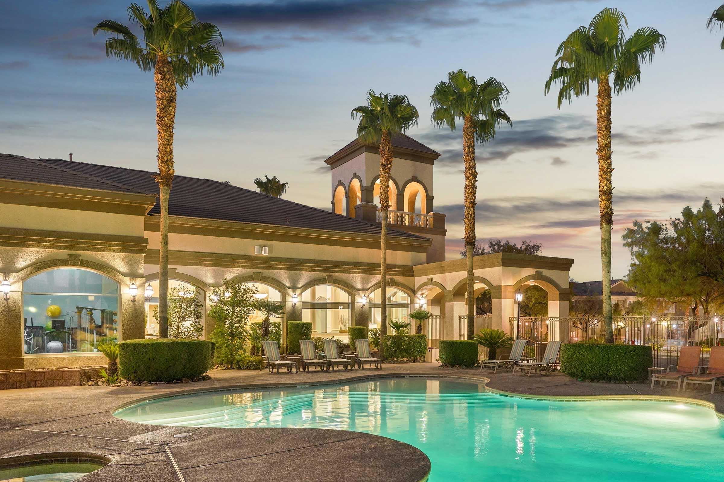 swimming pool with clubhouse in background