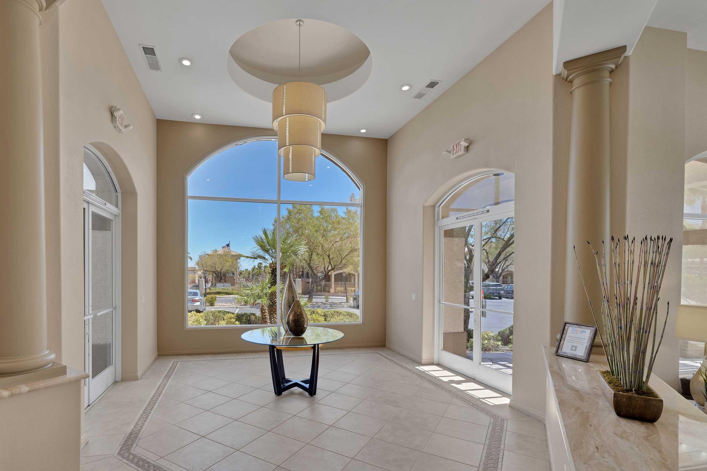 clubhouse entrance with chandelier