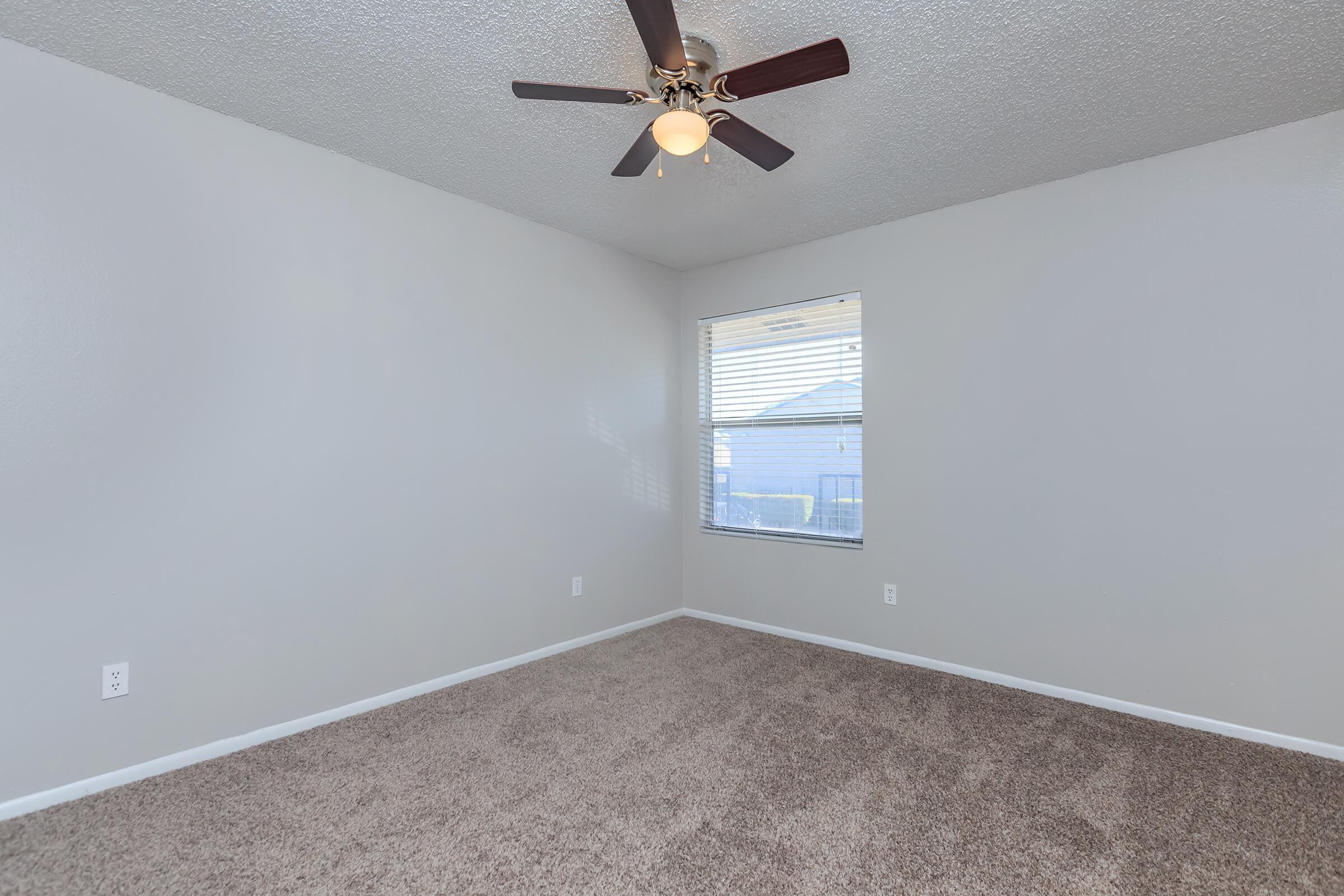 a bedroom with a large window