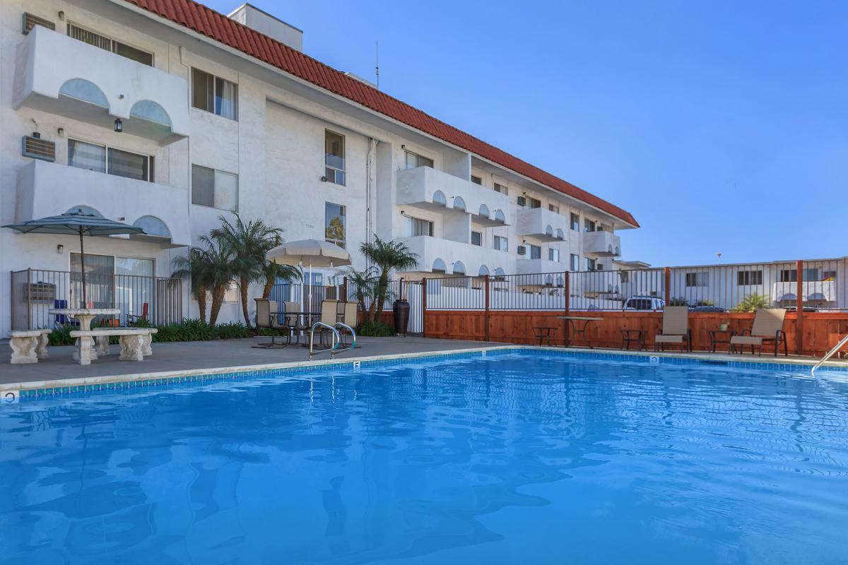 a large pool of water in front of a house