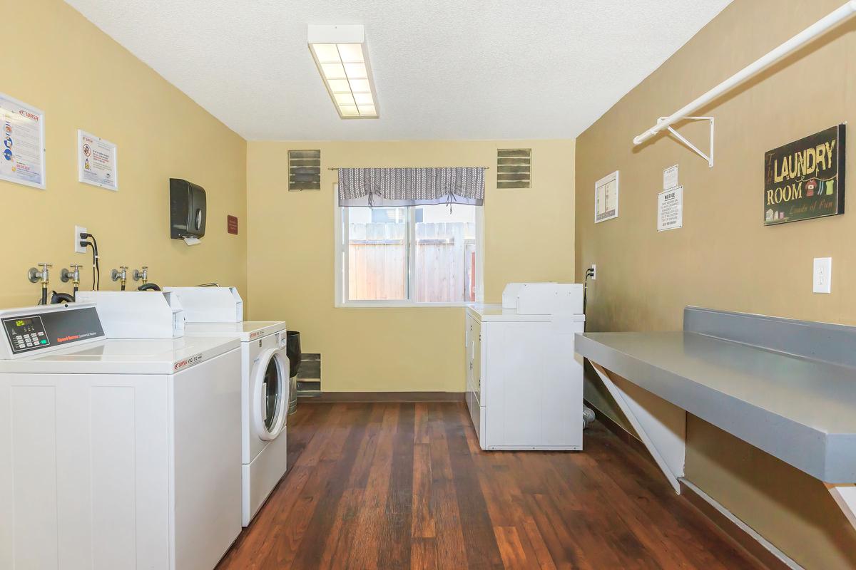 a kitchen with a wood floor