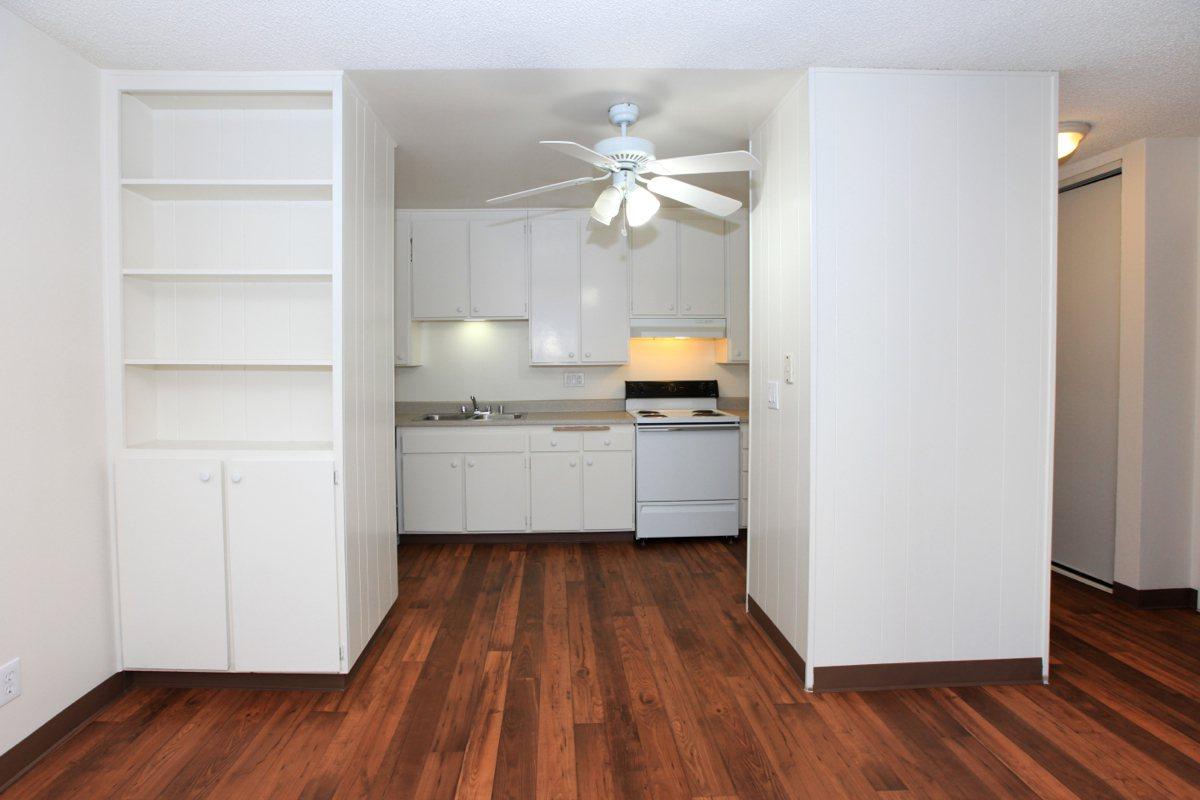 a kitchen with a hard wood floor