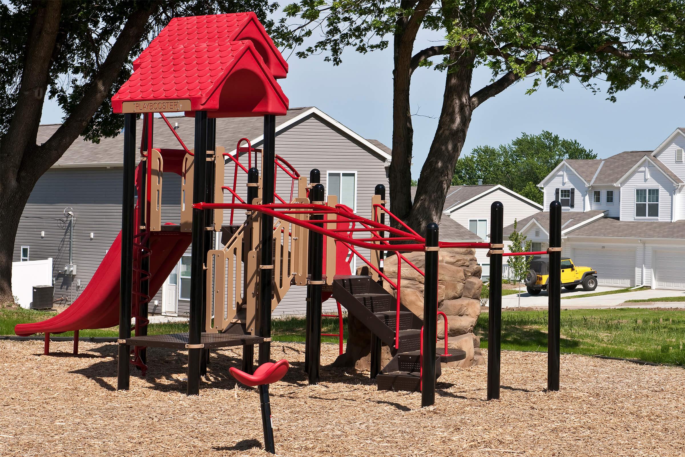 a group of lawn chairs sitting on top of a playground