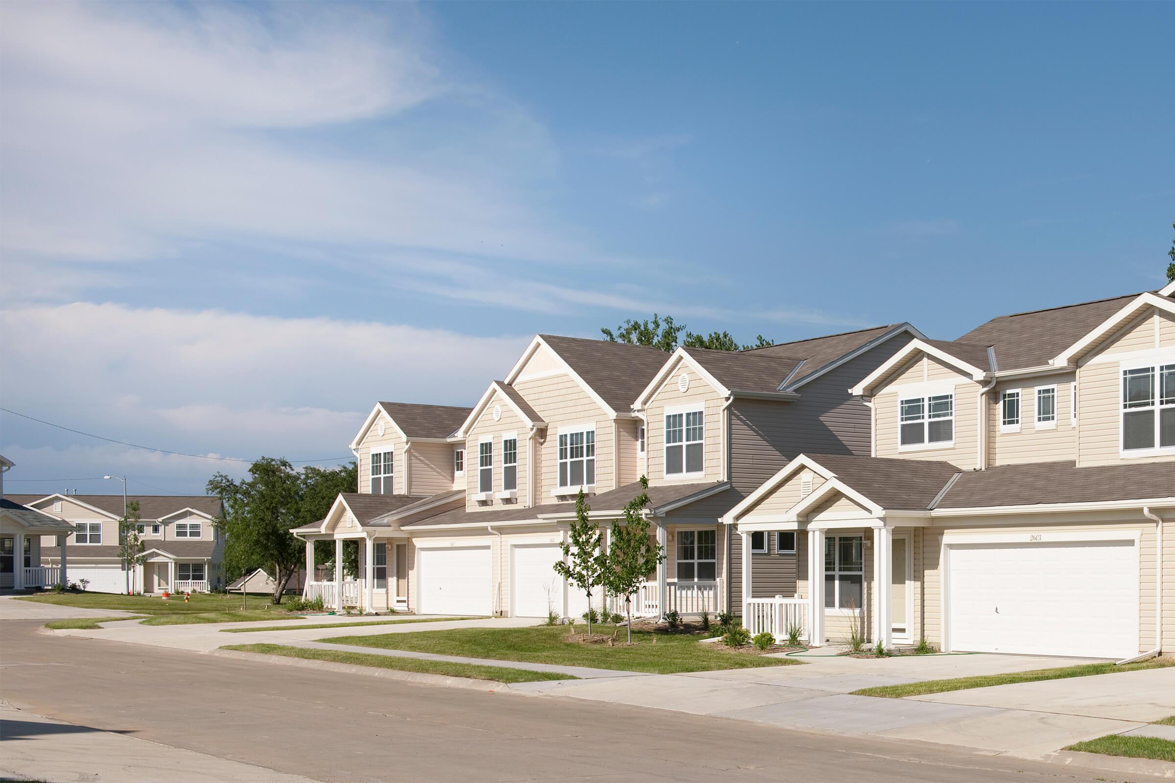 a residential street in front of a house