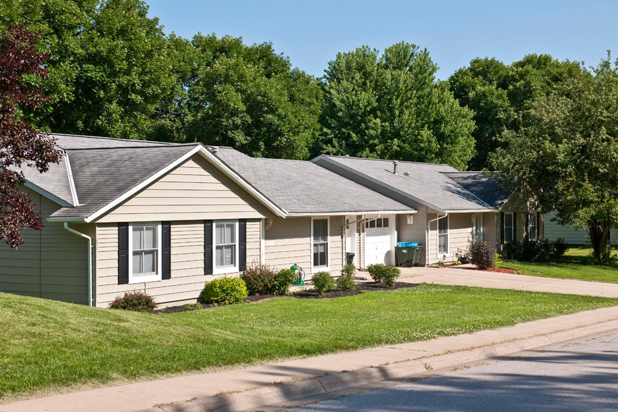 a residential street in front of a house