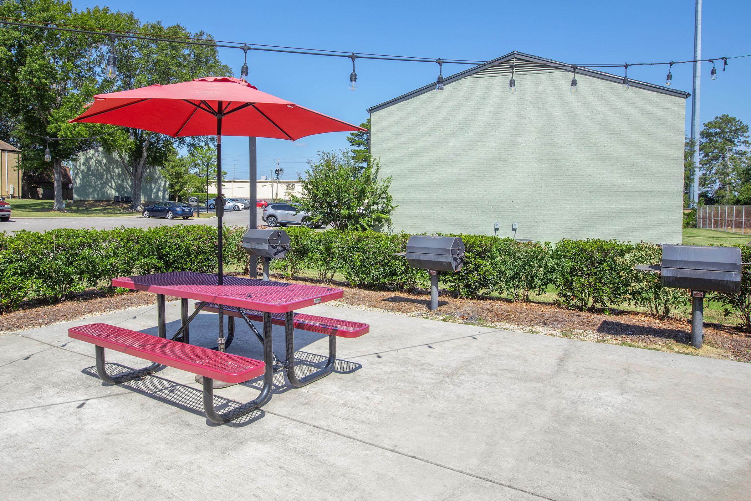 an umbrella sitting on top of a bench