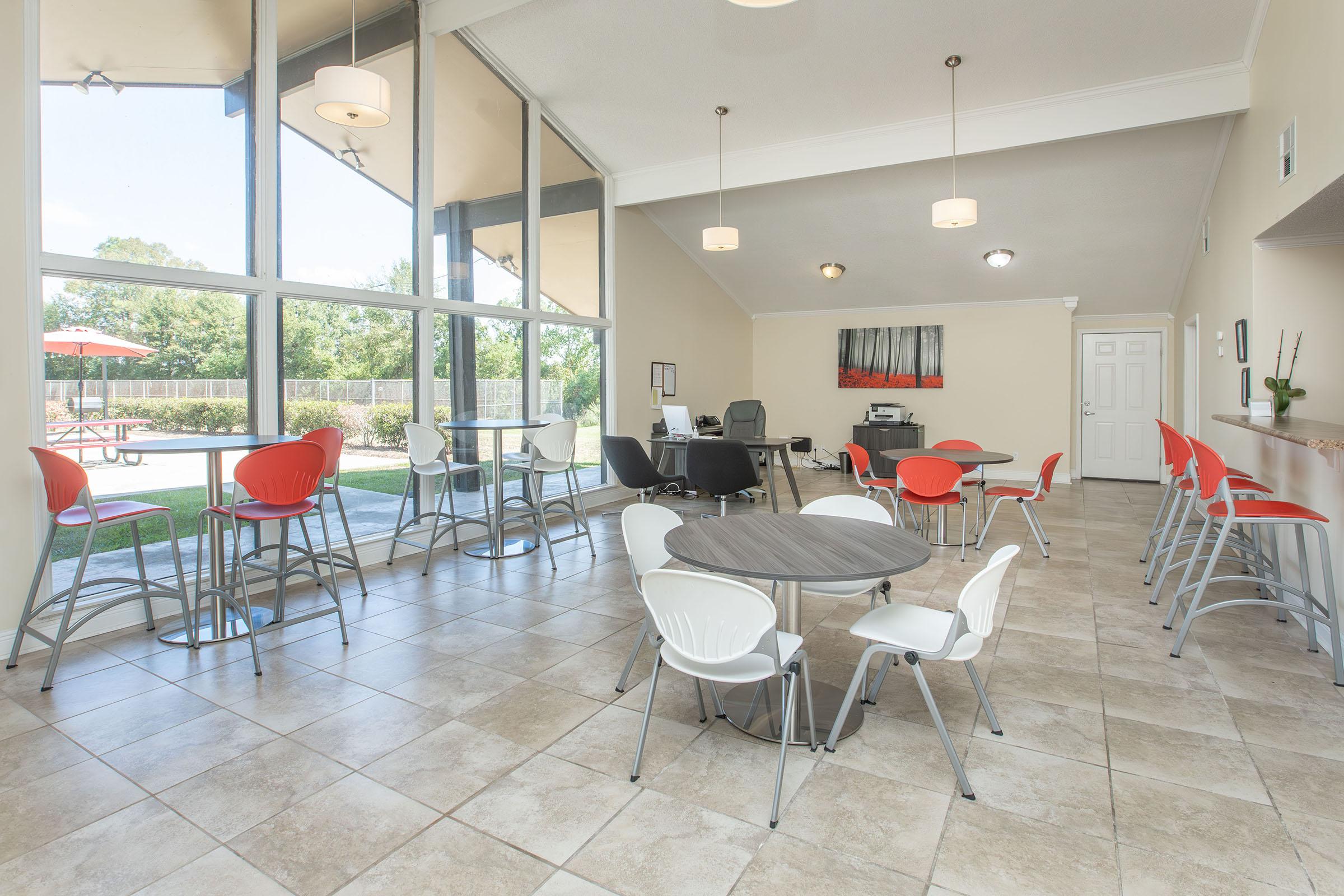 a room filled with furniture and a table