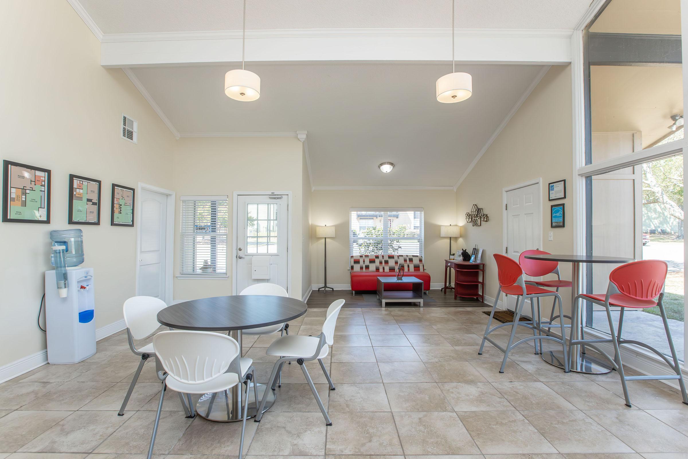 a room filled with furniture and a table