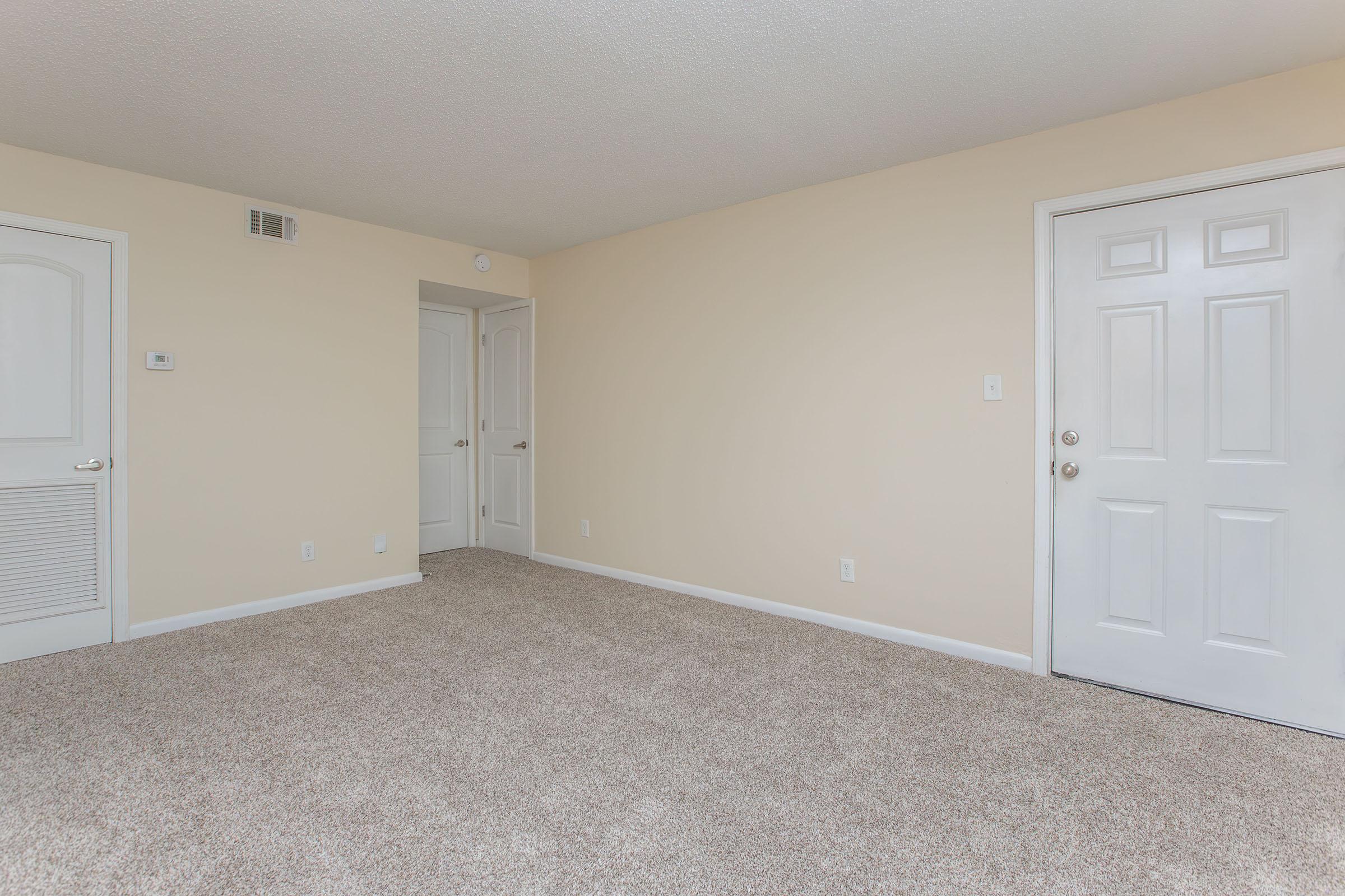 a room filled with furniture and a flat screen tv