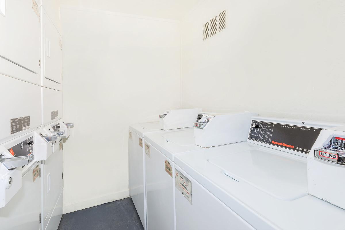 a white refrigerator freezer sitting inside of a kitchen