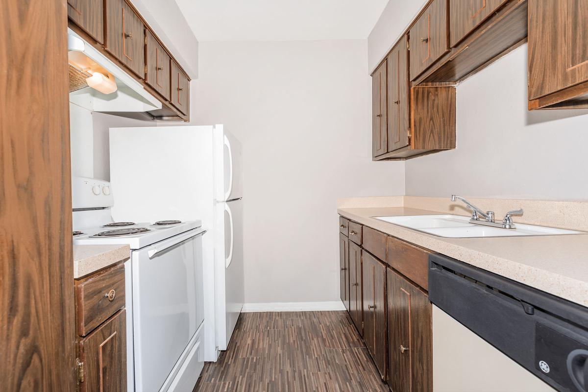 a kitchen with a sink and a refrigerator