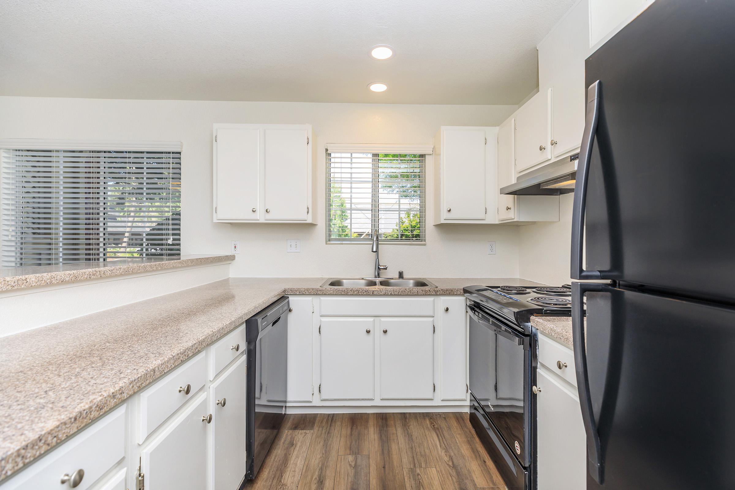 a kitchen with a stove and a refrigerator