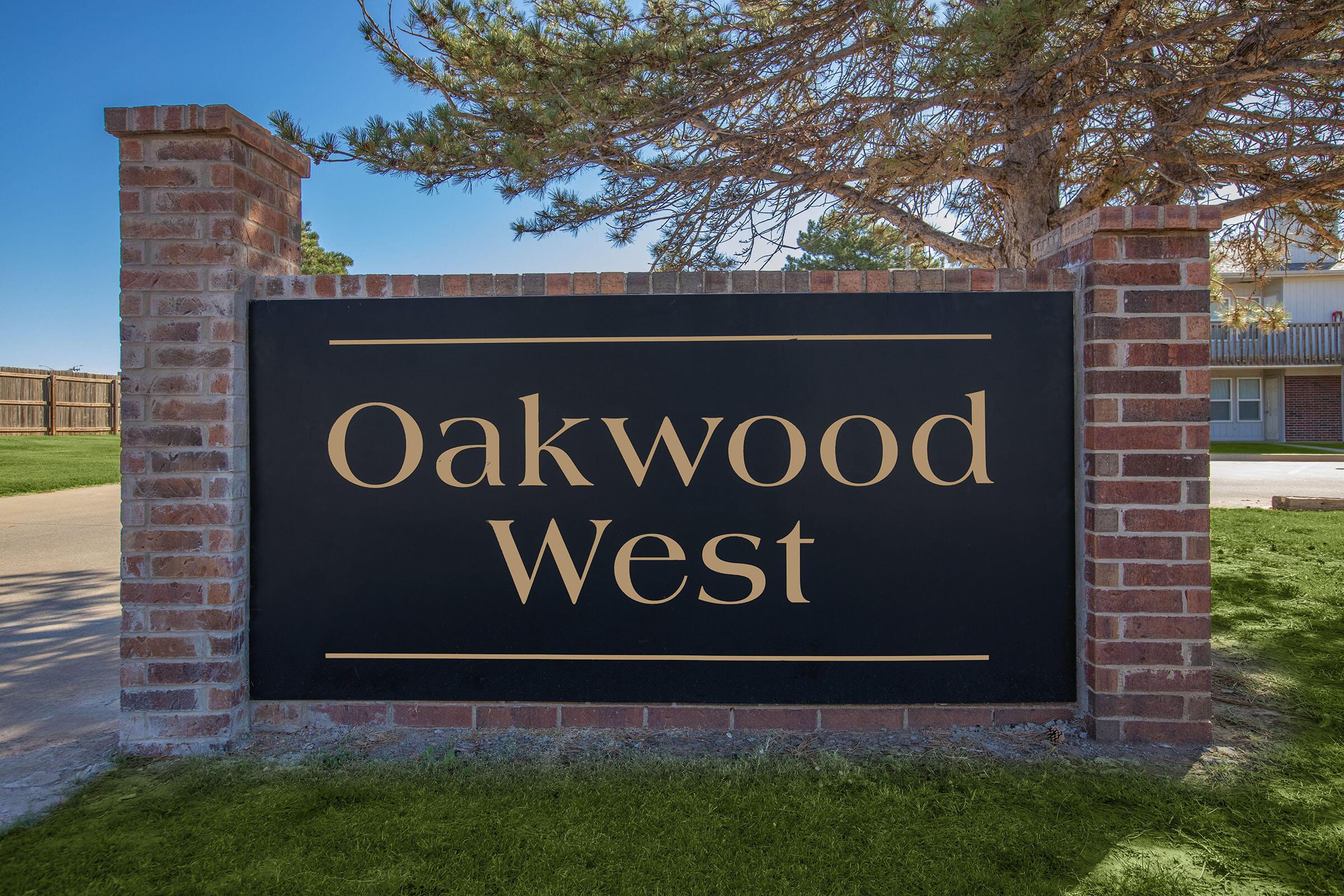 a sign in front of a brick building