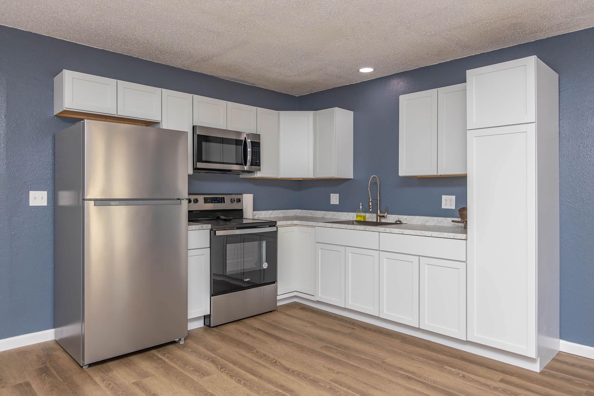 a stainless steel refrigerator in a kitchen