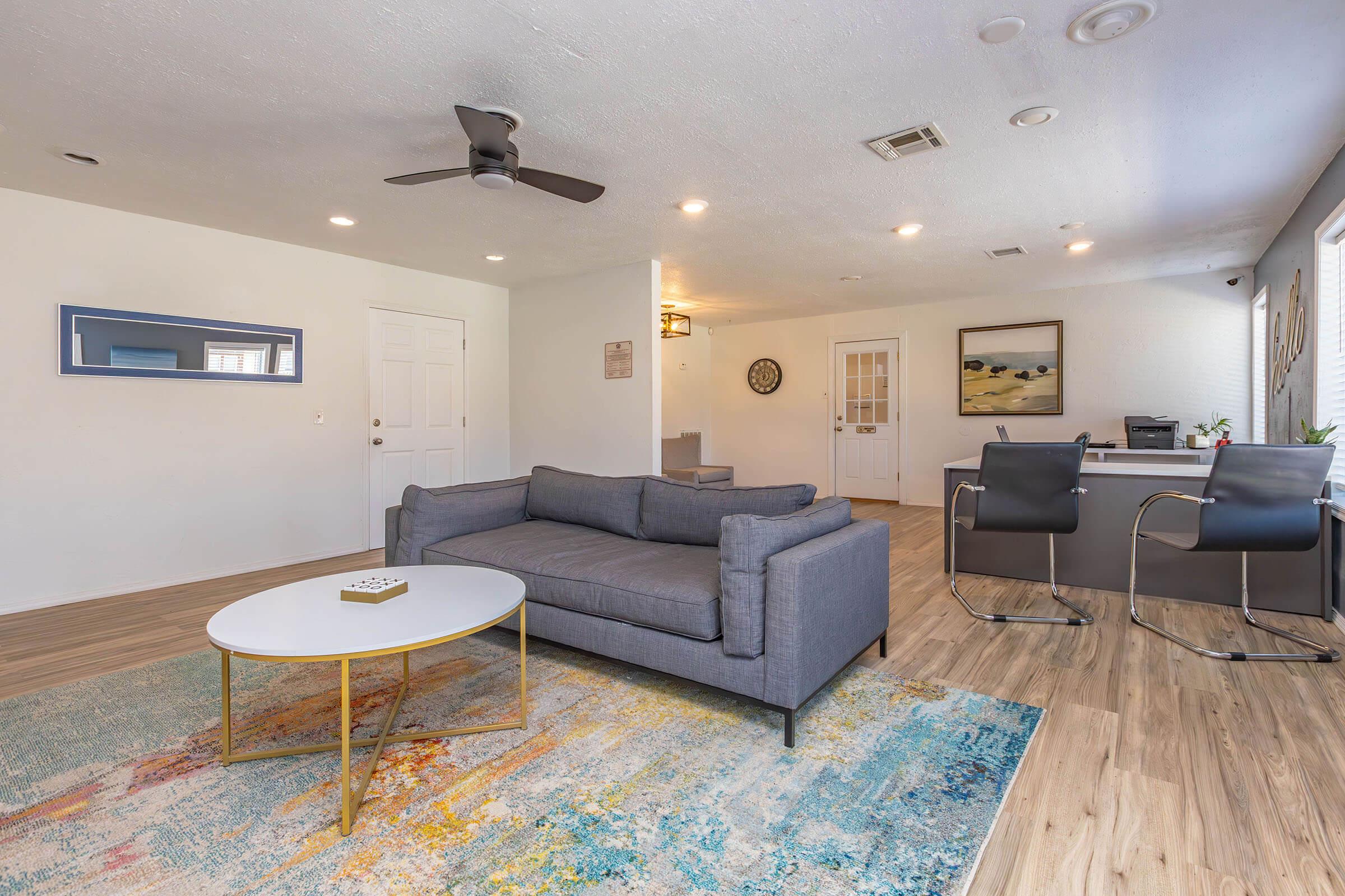 a living room filled with furniture and a rug