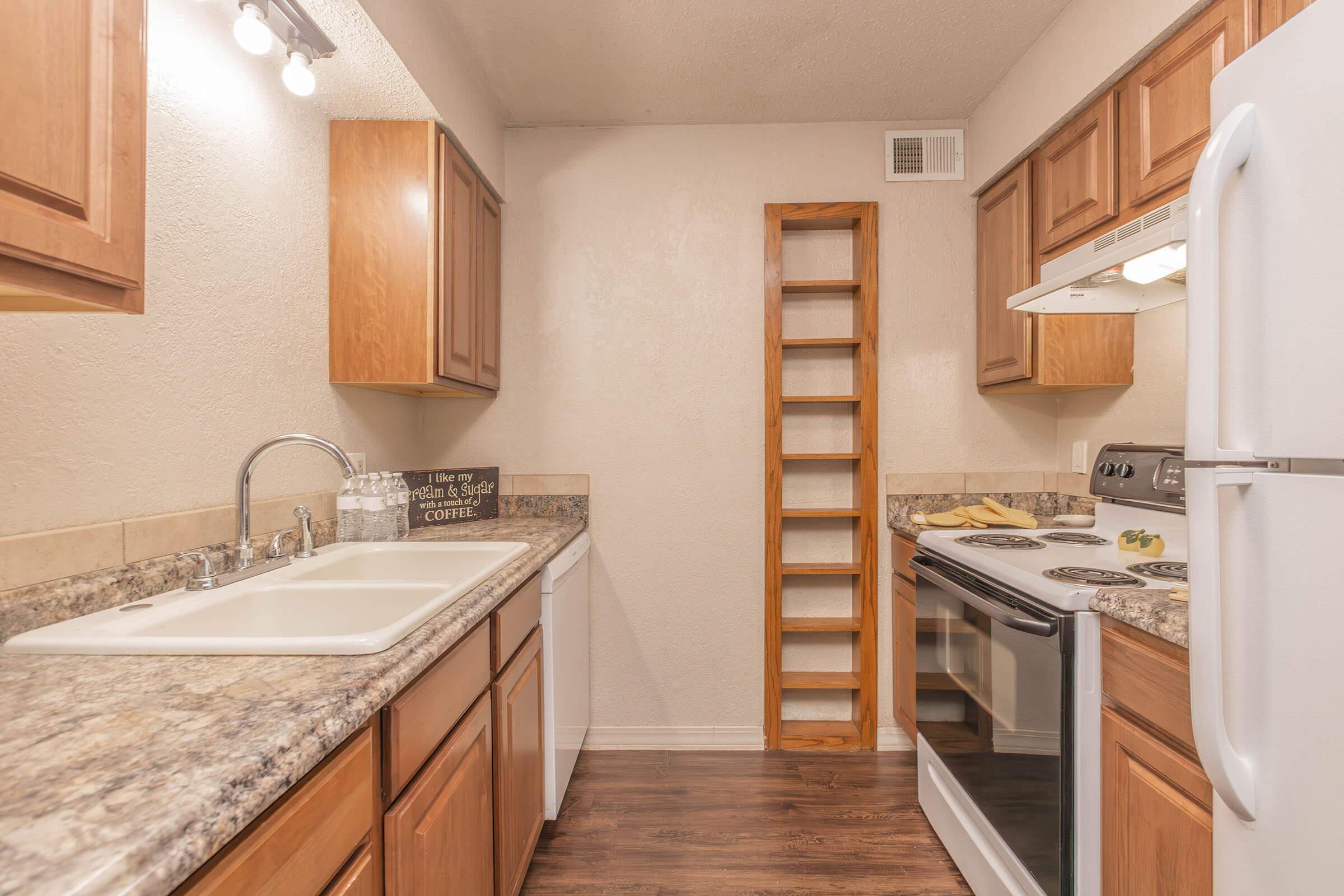 a kitchen with a stove and a sink