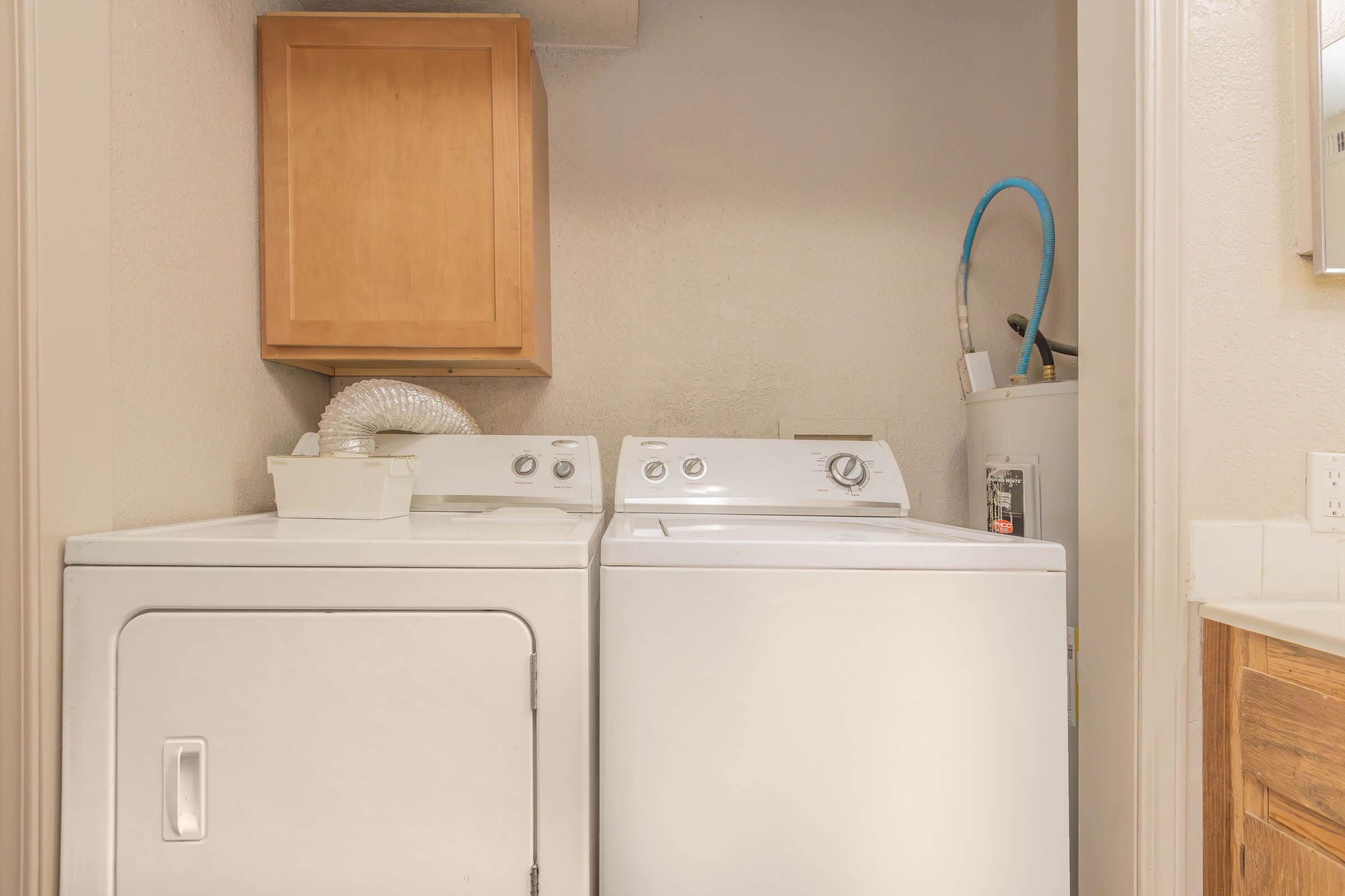 a microwave oven sitting on top of a refrigerator