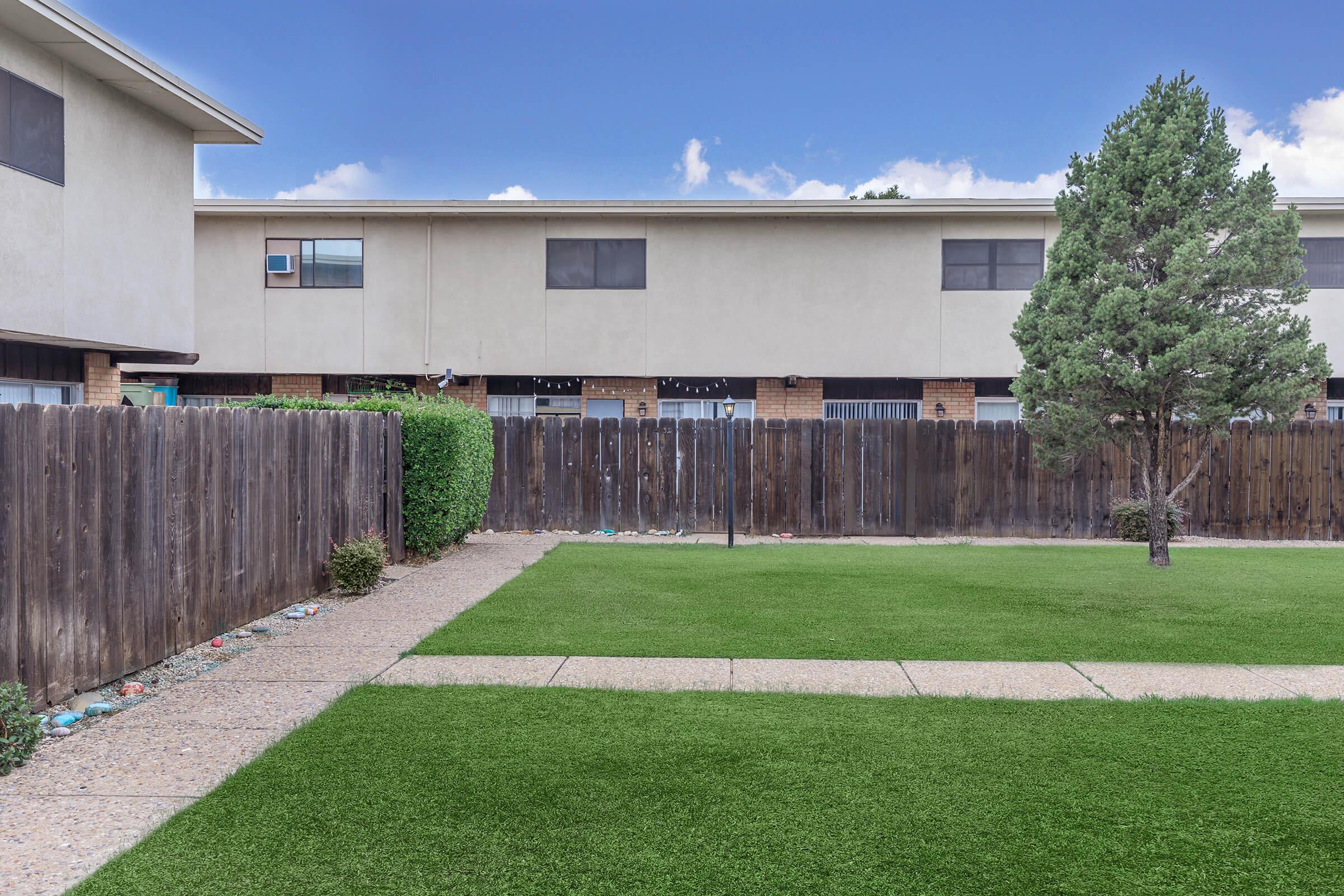 a large lawn in front of a house