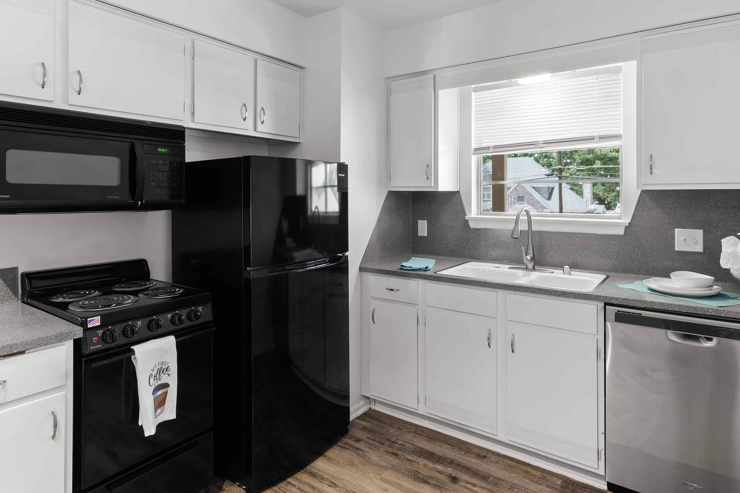 a kitchen with a sink and a refrigerator