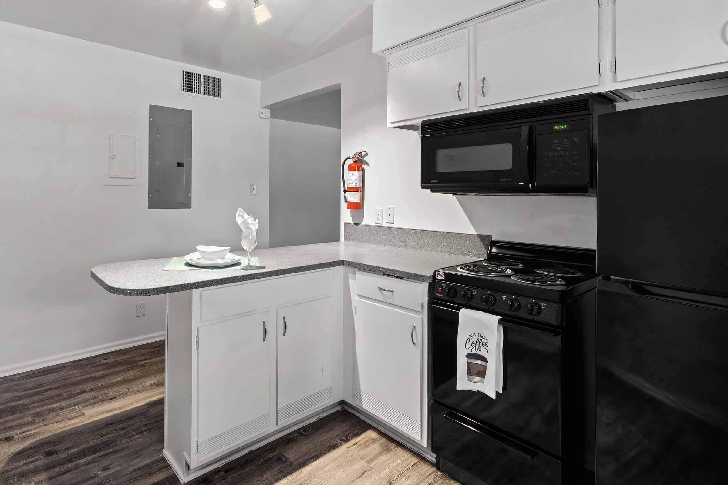 a kitchen with a stove top oven sitting inside of a refrigerator